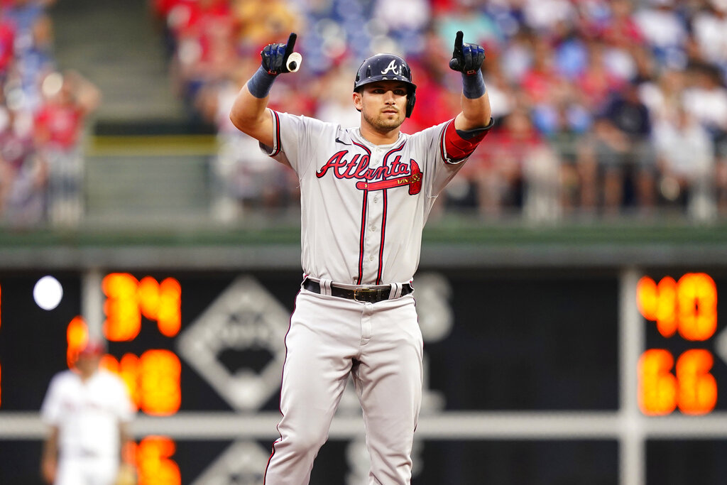 Atlanta Braves' Austin Riley reacts after hitting a run-scoring double against Philadelphia Phillies pitcher Aaron Nola during the first inning of a baseball game, Tuesday, July 26, 2022, in Philadelphia. (AP Photo/Matt Slocum)