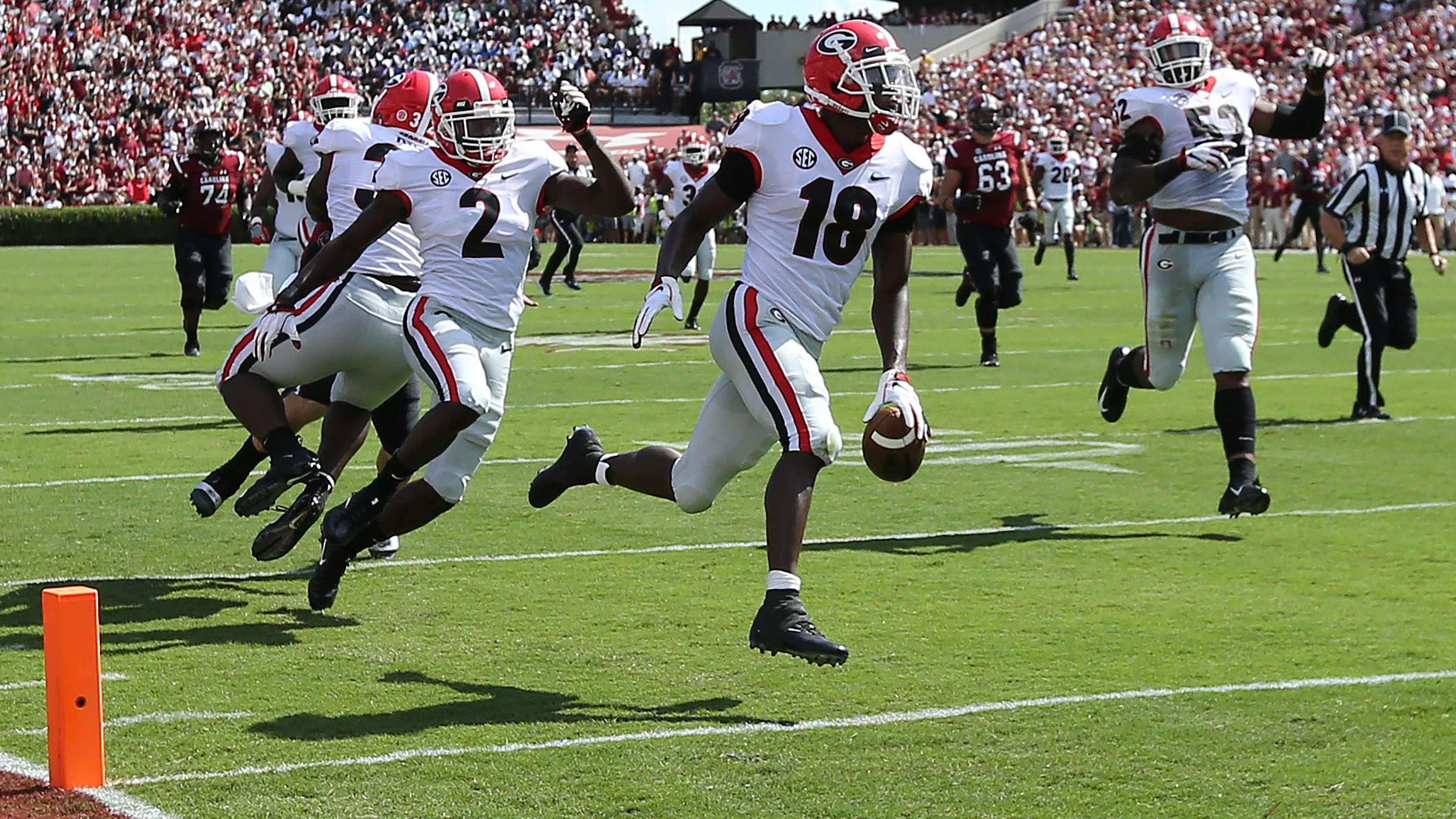 Georgia Bulldogs defensive back Deandre Baker (18) gegs flagged for  excessive celebration after intercepting an Alabama pass in the third  quarter of the NCAA College Football Playoff National Championship at  Mercedes-Benz Stadium