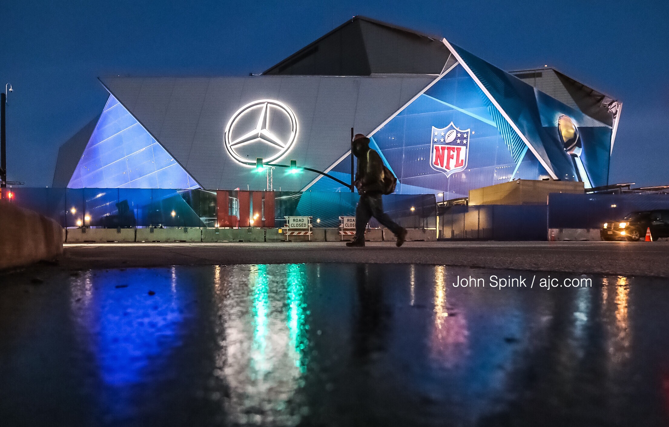 A thin layer of ice coats the ground outside Mercedes Benz-Stadium Wednesday morning. (JOHN SPINK / JSPINK@AJC.COM)