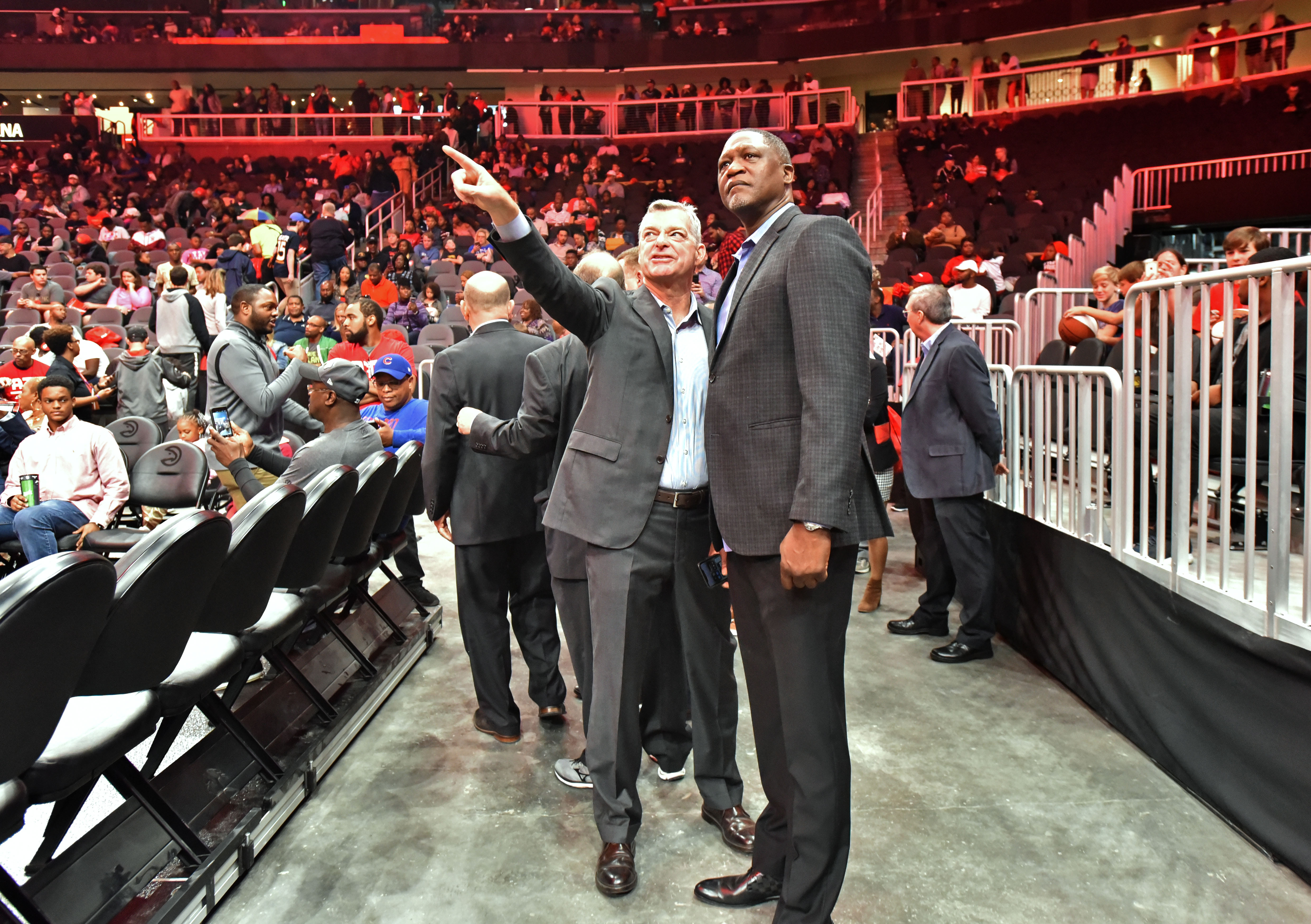 Hawks principal owner Tony Ressler and former Hawks superstar Dominique Wilkins talk during State Farm Arena’s open house on Saturday.