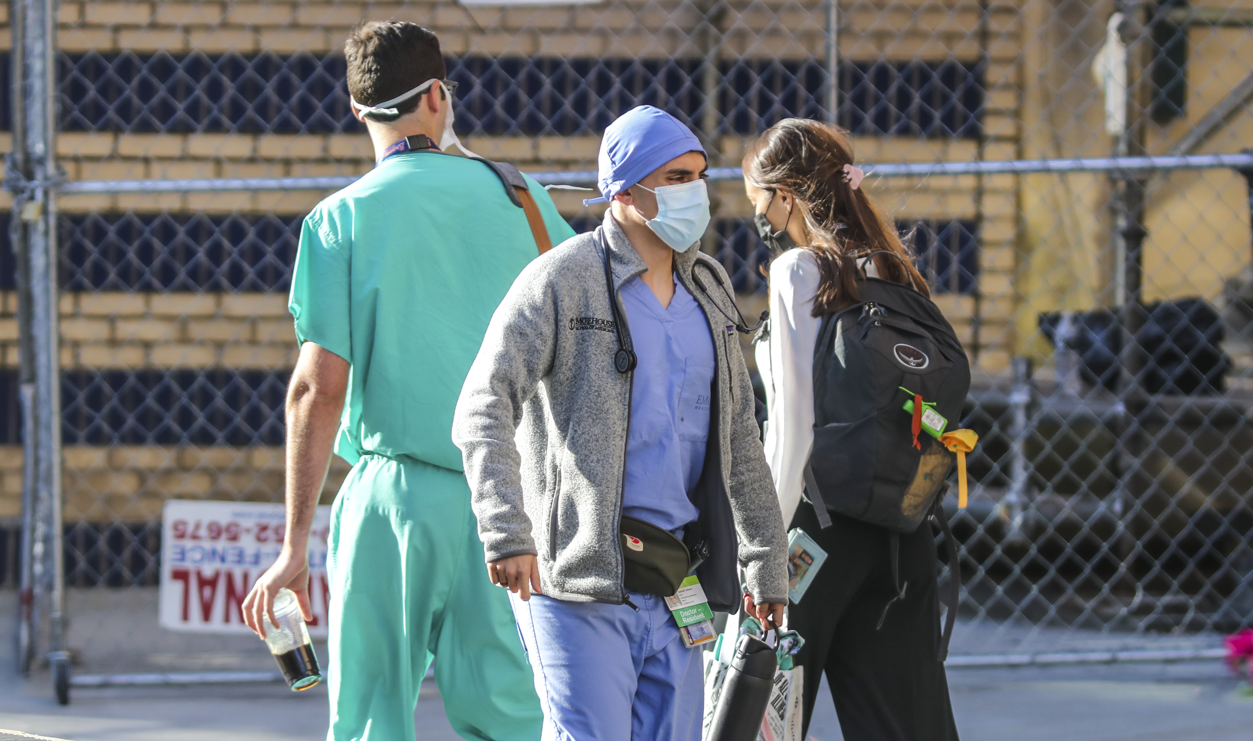 Medical workers move between buildings Friday at Grady Memorial Hospital in downtown Atlanta. (John Spink / John.Spink@ajc.com)