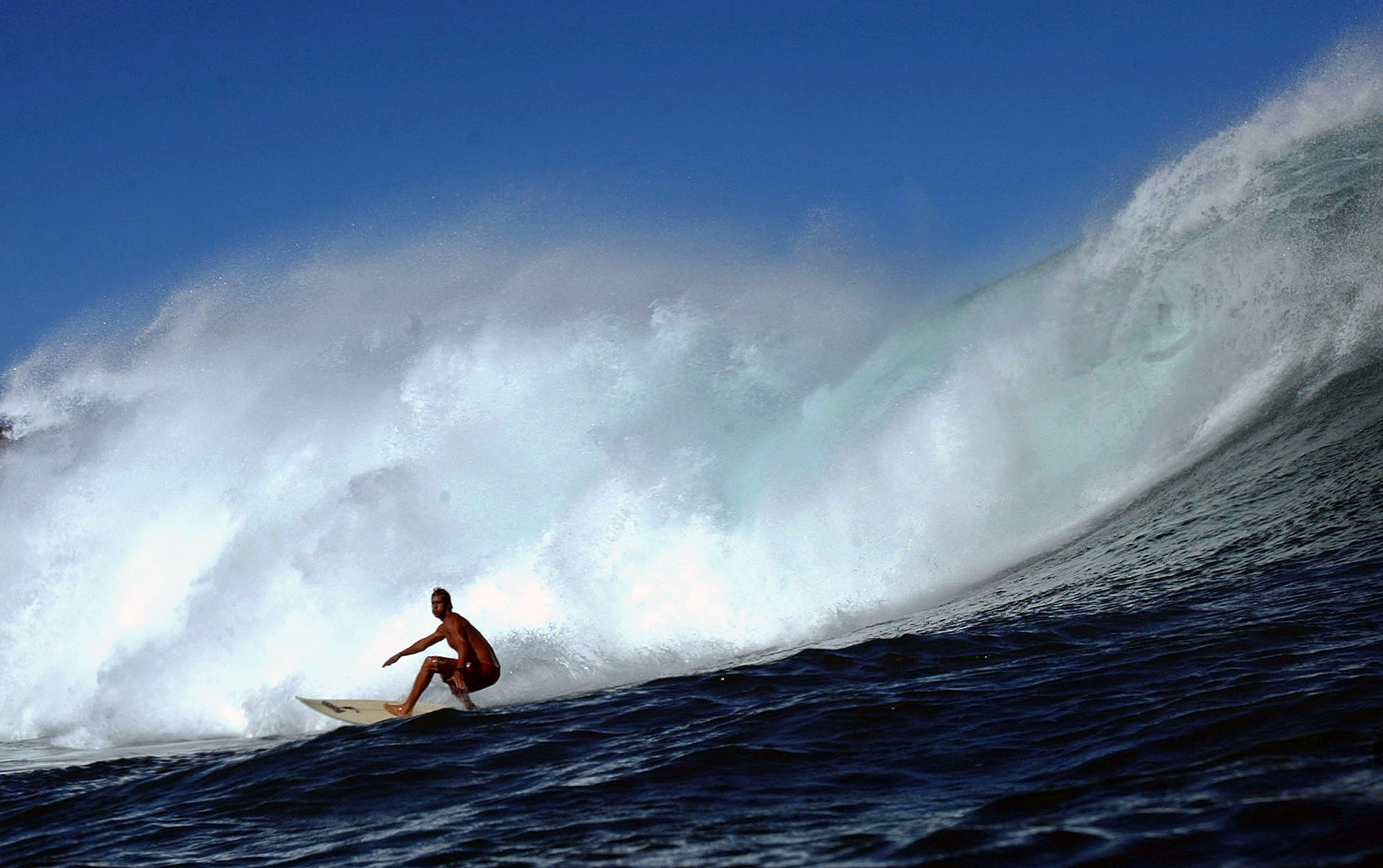 Surfer Rob Burns drops into a large wave during a large swell on January 10, 2004 at Windmills in Kapalua, Maui, Hawaii. (Photo by Donald Miralle/Getty Images)