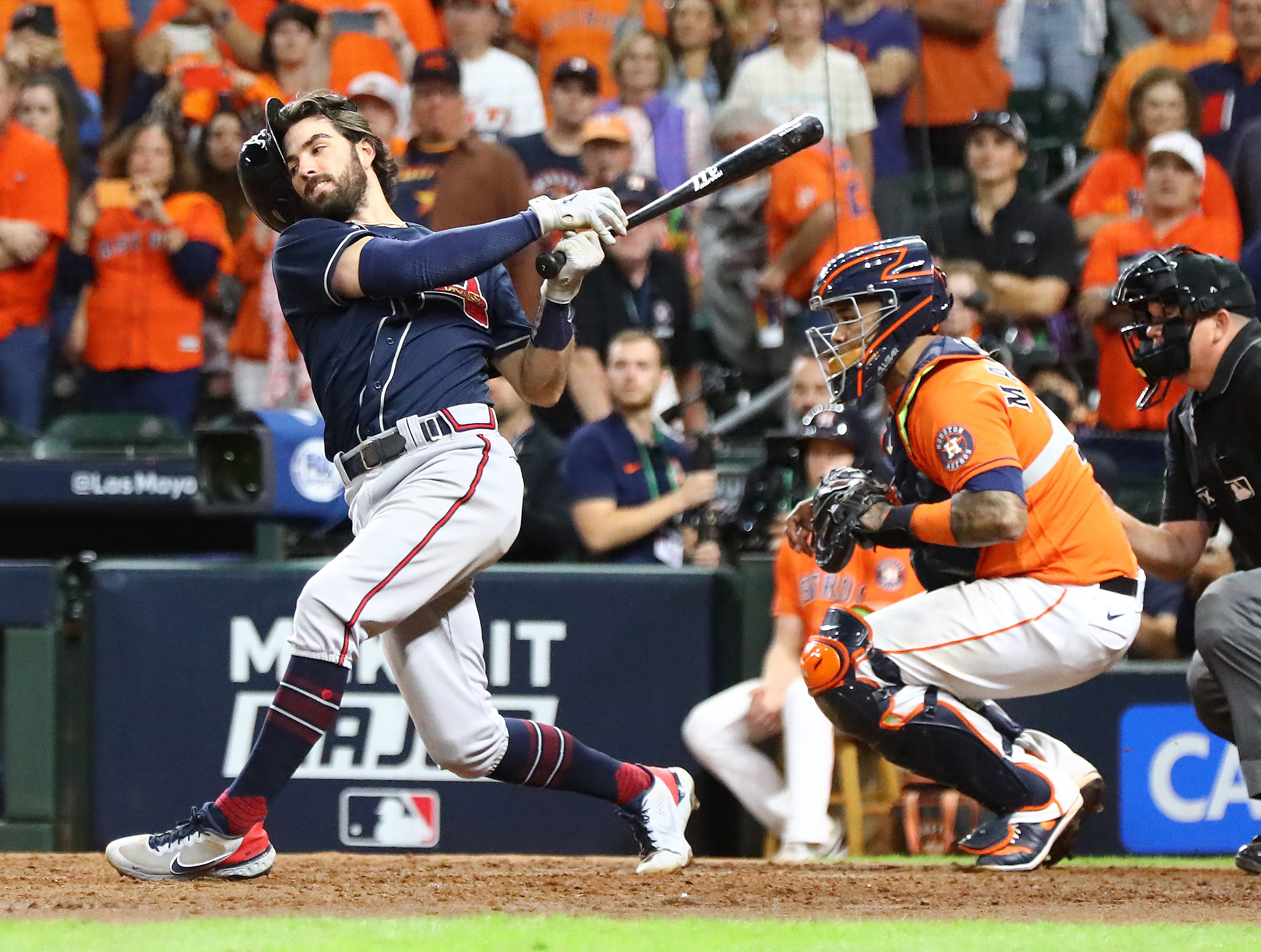 Braves shortstop Dansby Swanson loses his helmet as he strikes out in the 9th inning to end the game in a 7-2 loss to the Astros in game 2 of the World Series on Wednesday, Oct. 27, 2021, in Houston. “Curtis Compton / Curtis.Compton@ajc.com”