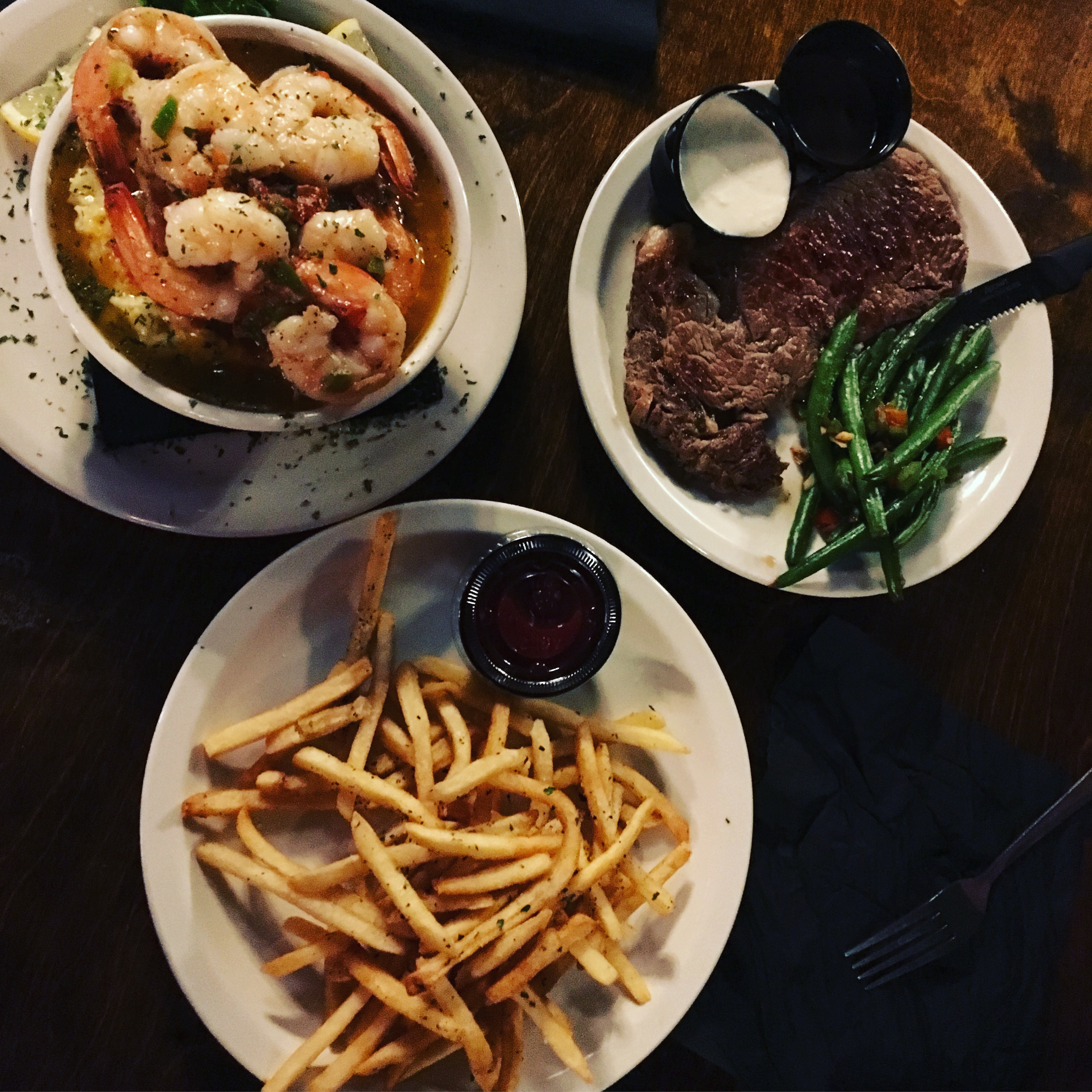 Some of the food offerings at Uptown includes shrimp and grits and rib eye. CREDIT: Helen Kim Ho