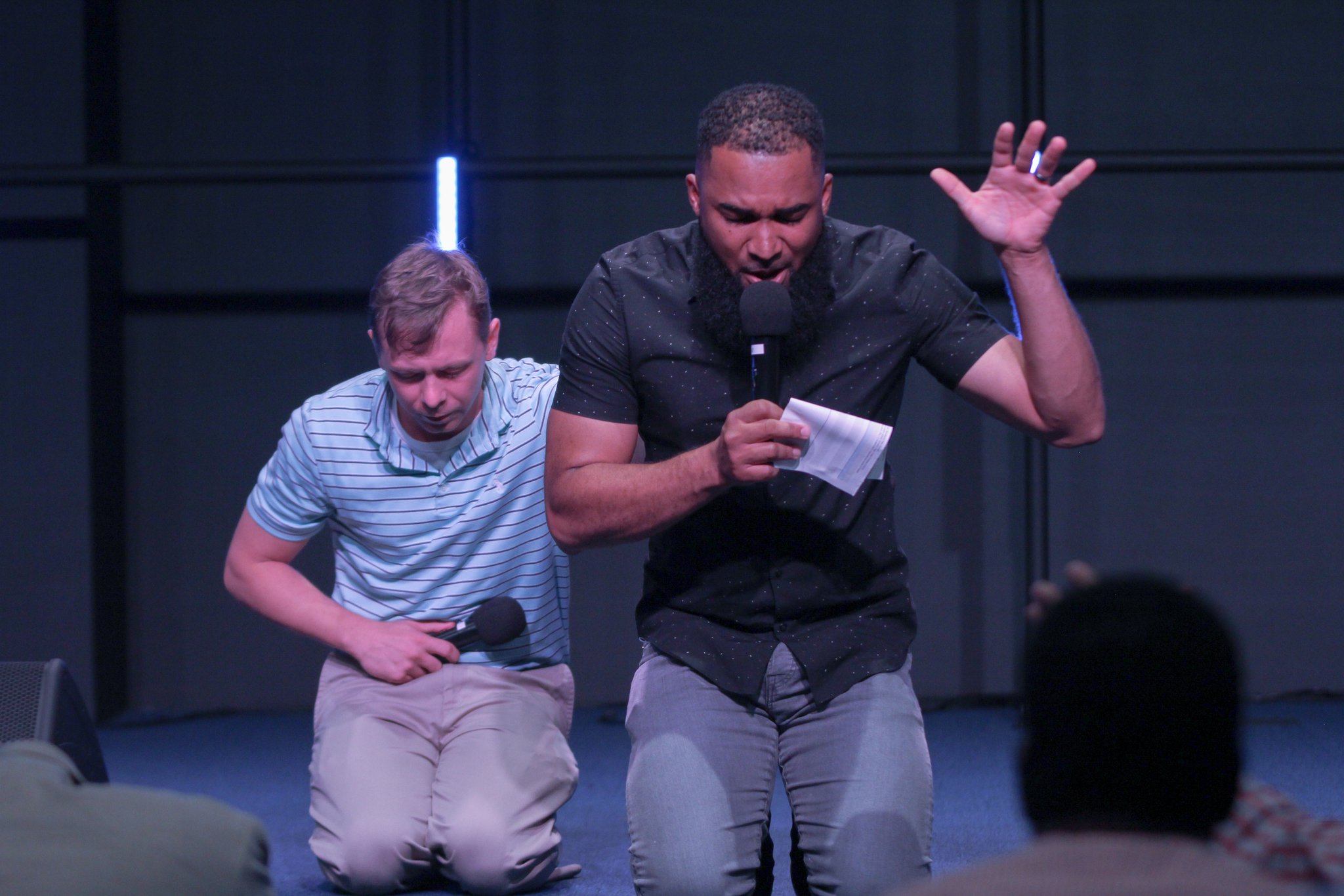 Josh Clemons (right) and Hazen Stevens, co-directors of OneRace, pray together for racial reconciliation.