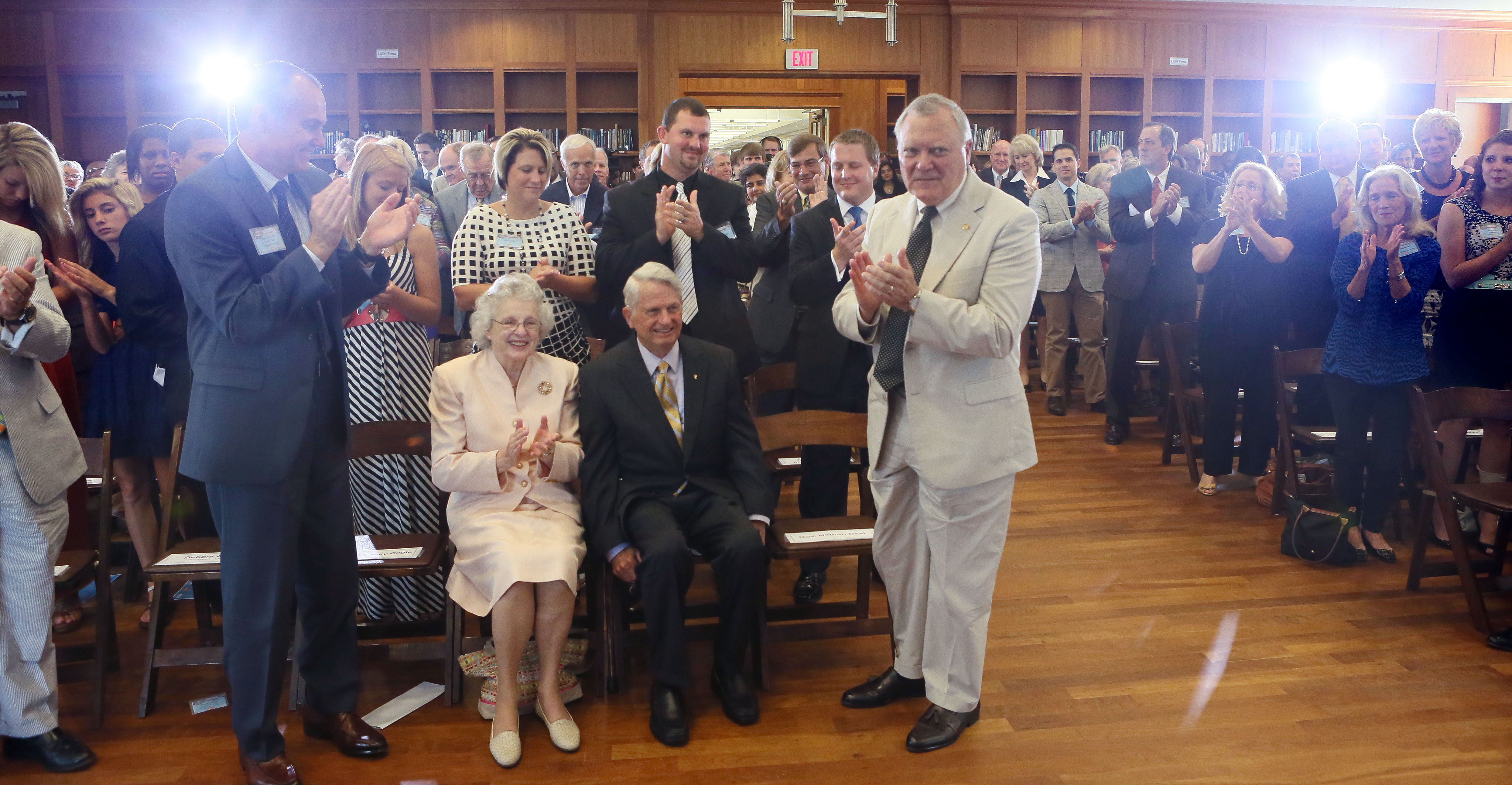 June 26, 2013 - Athens - At the close of the event, Zell Miller (seated), with his wife Shirley by his side, receives a third standing ovation. In late June 1993, Gov. Zell Miller bought the first lottery ticket ever sold in Georgia. Today, 20 years later to the day, Miller, Gov. Nathan Deal and other dignitaries gathered at the University of Georgia Zell B. Miller Learning Center for a Lottery 20th Anniversary Ceremony. BOB ANDRES / BANDRES@AJC.COM