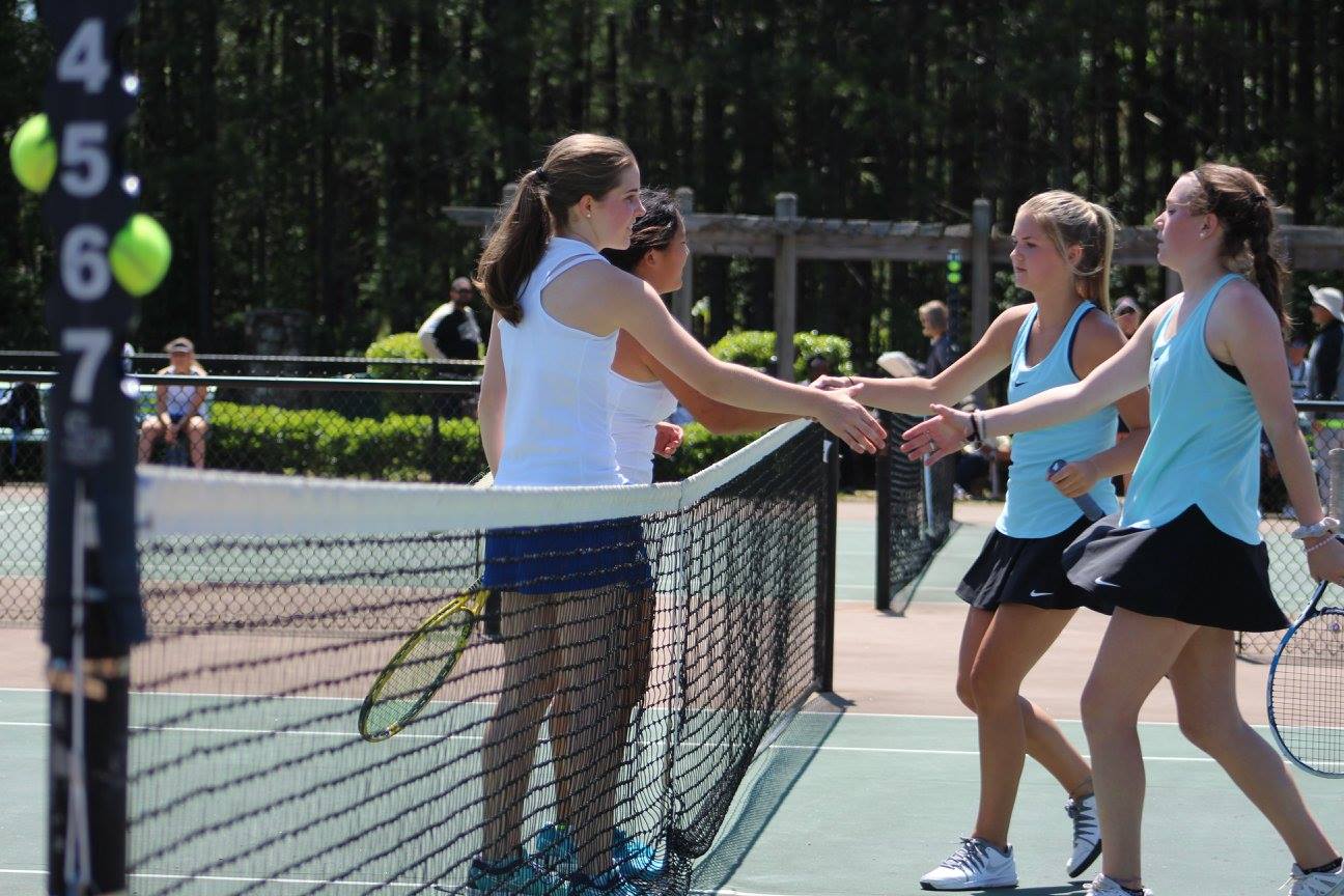 Chamblee's team of Madeline Meer and Madison Trinh shake hands with Strr's Mills' Carolina Kingsley and Megan Fox.