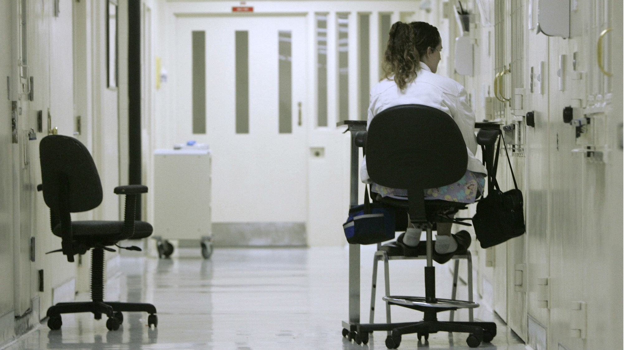 A medical worker keeps a vigil outside the isolation cell of an inmate on suicide watch at the California State Prison-Sacramento in Folsom in this March 2008 photo. The chief psychiatrist for California's prison system alleged in a report made public Oct. 31, 2018, that state officials have provided inaccurate or misleading information to a federal judge and inmates' attorneys, giving the false impression that the system is properly caring for mentally ill inmates. U.S. District Judge Kimberly Mueller, who oversees mental health care in California's prisons as part of an ongoing federal lawsuit, said she plans to hear public testimony from the whistleblower.