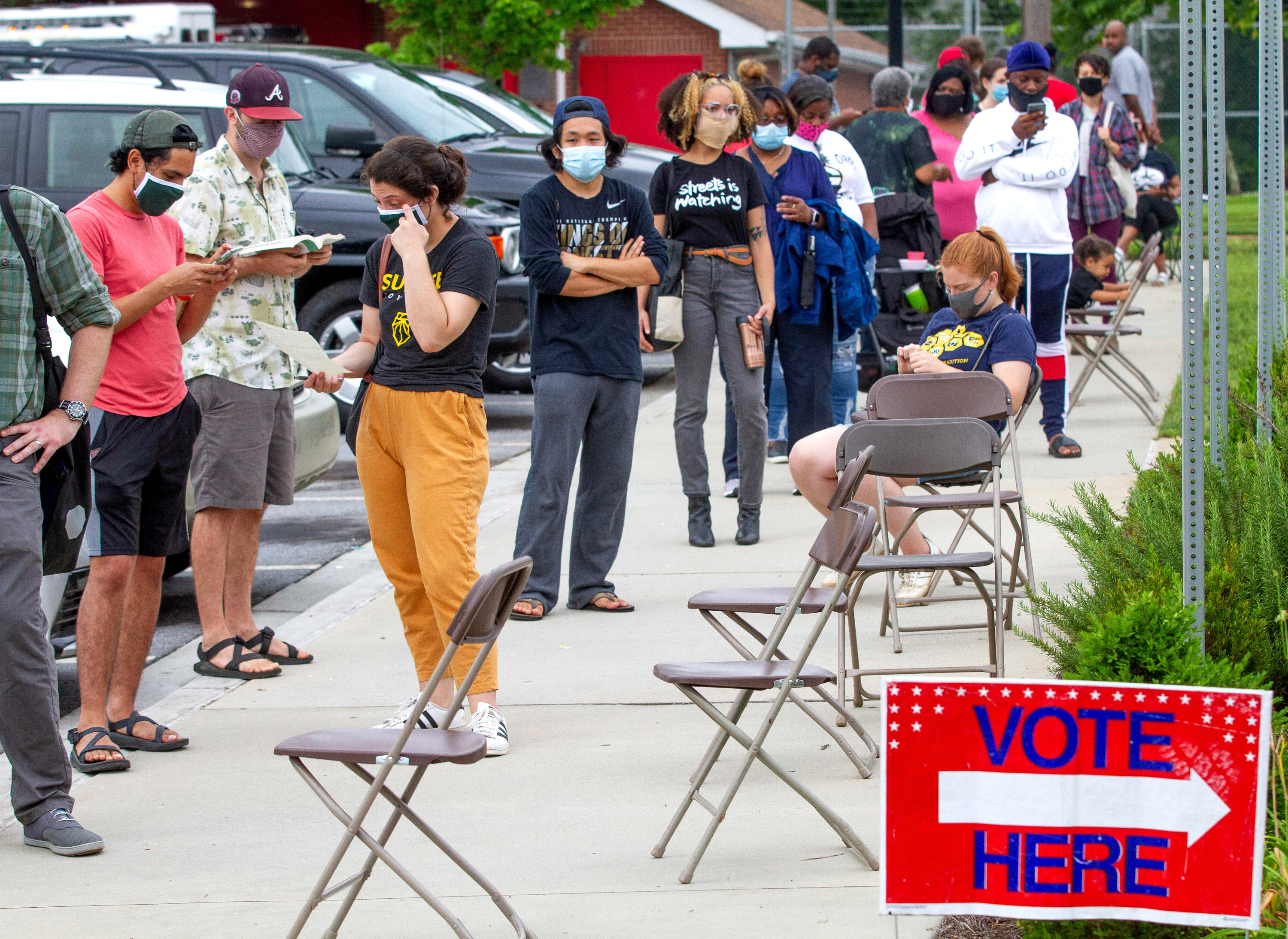 Voters wait in a long line that stretched around the Metropolitan Library Tuesday, June 9, 2020. STEVE SCHAEFER FOR THE ATLANTA JOURNAL-CONSTITUTION