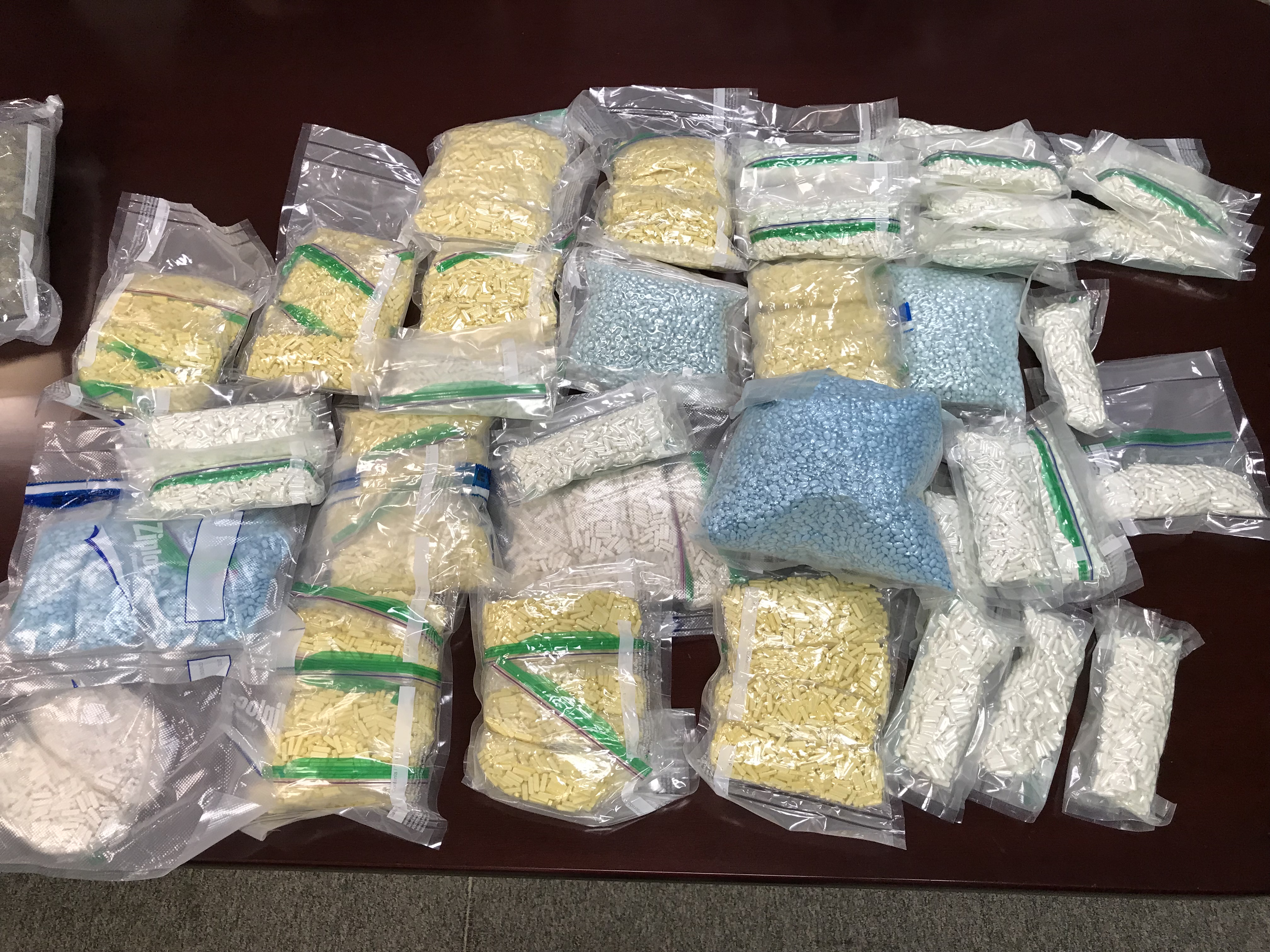 Narcotics agents discovered more than 50,000 pills believed to contain fentanyl and alprazolam at the home and storage units of a Cherokee County couple, authorities said.