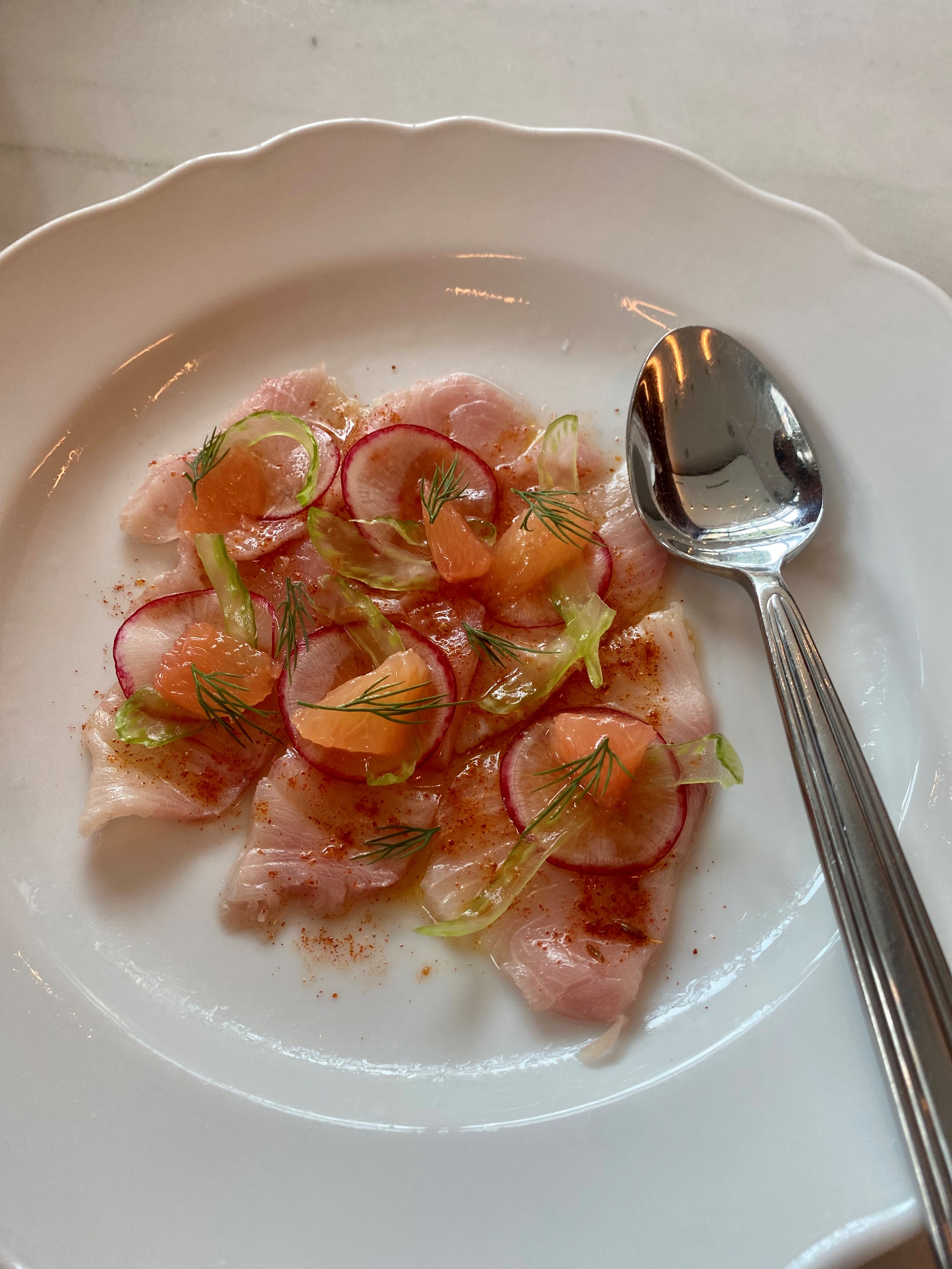 This raw hamachi at Lucian shimmers with grapefruit, celery, radish and a pinch of Berber spice.  Wendell Brock for the Atlanta Journal-Constitution