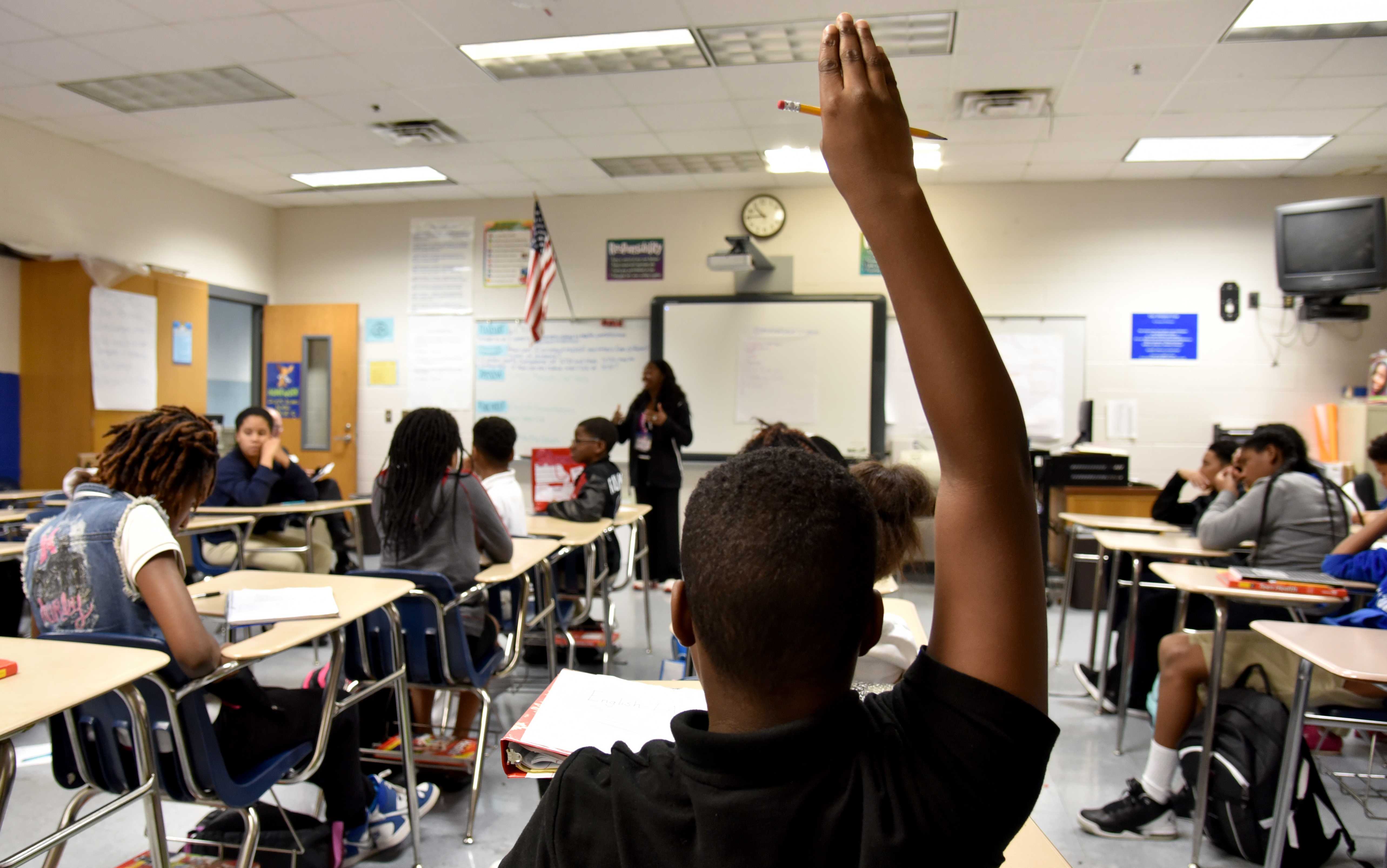 A teacher answers questions from students during a middle school sex education class at Stephenson Middle School in DeKalb County in 2015. BRANT SANDERLIN/BSANDERLIN@AJC.COM