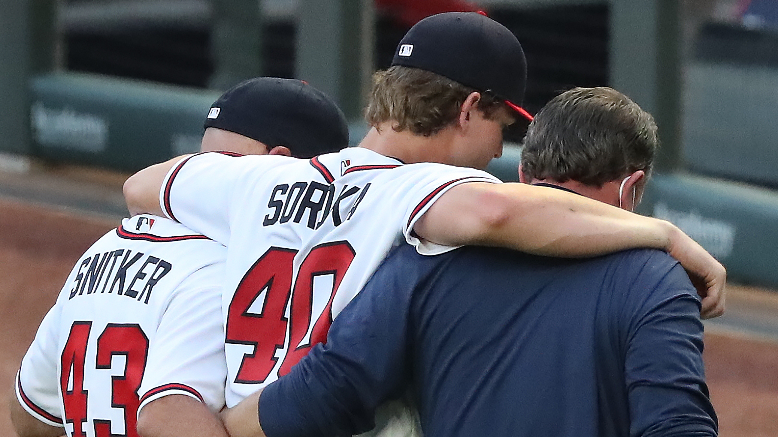 Spencer Strider of the Atlanta Braves talks with Mike Soroka of