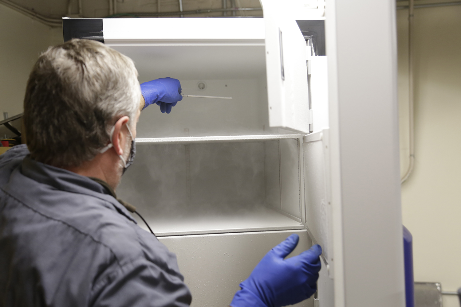 A Northeast Georgia Health System employee is getting a freezer ready to store Pfizer vaccines after the freezer arrived in early December. (Courtesy of Northeastt Georgia Health System)
