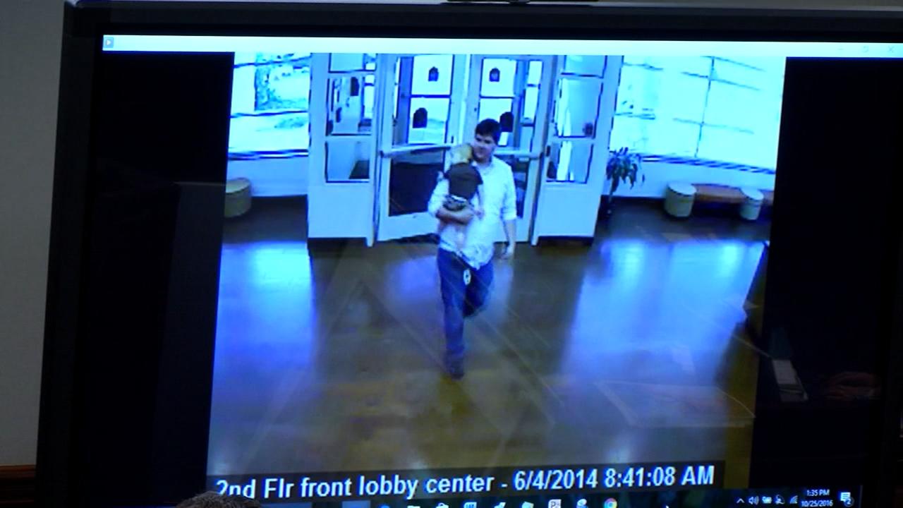 The defense team for Justin Ross Harris shows a video of Harris dropping Cooper off at his daycare, during Harris' murder trial at the Glynn County Courthouse in Brunswick, Ga., on Tuesday, Oct. 25, 2016. The defense was showing the jury that it wasn't uncommon for Cooper to be asleep when being dropped off. (screen capture via WSB-TV)