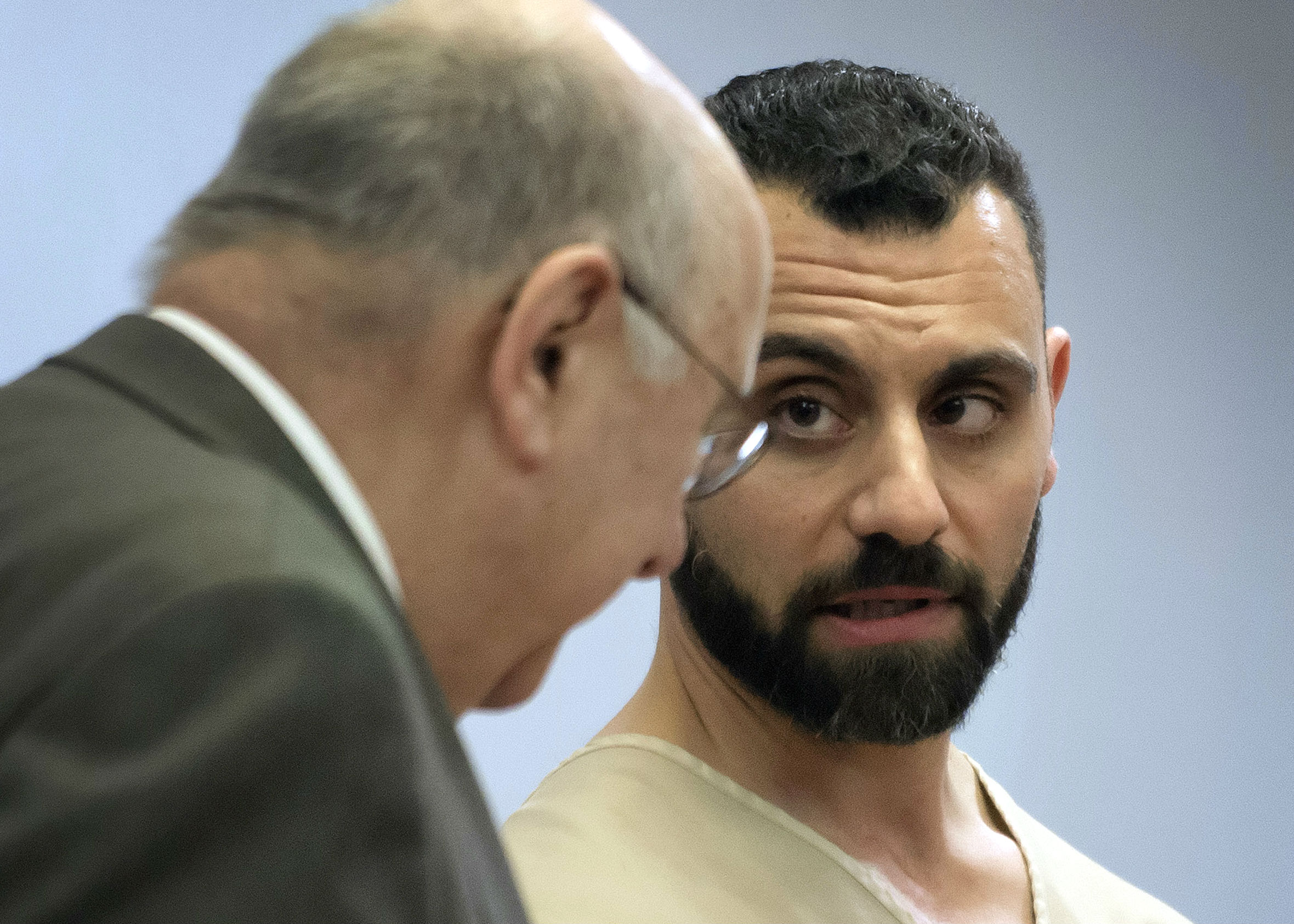 Richard Dabate, right, speaks with attorney Hubie Santos during his arraignment April 17, 2017, in Rockville Superior Court in Vernon, Conn. Dabate is charged in the fatal shooting of his wife, 39-year-old Connie Dabate, at their home on Dec. 23, 2015.