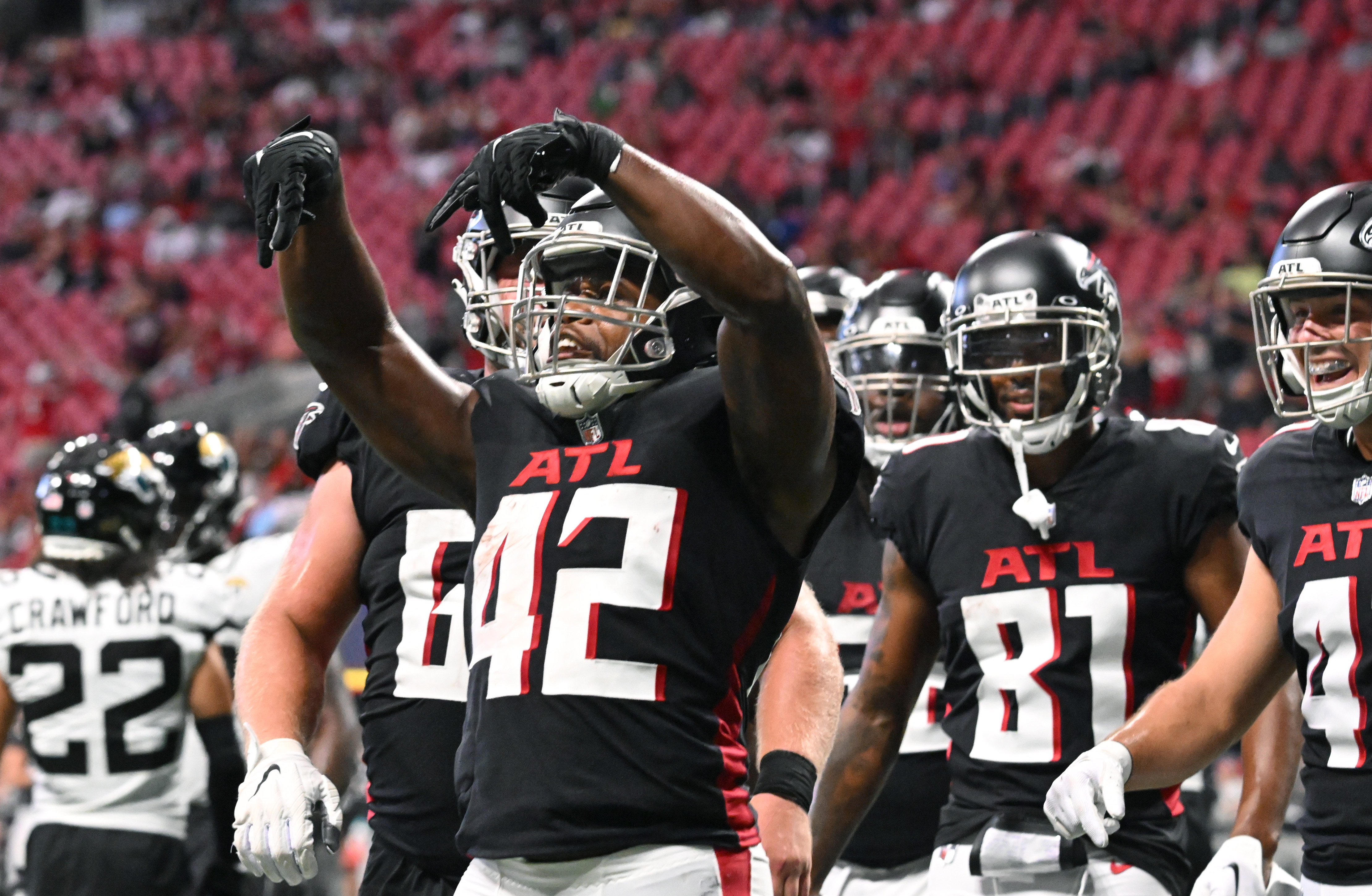 Atlanta Falcons running back Caleb Huntley (42) runs against the