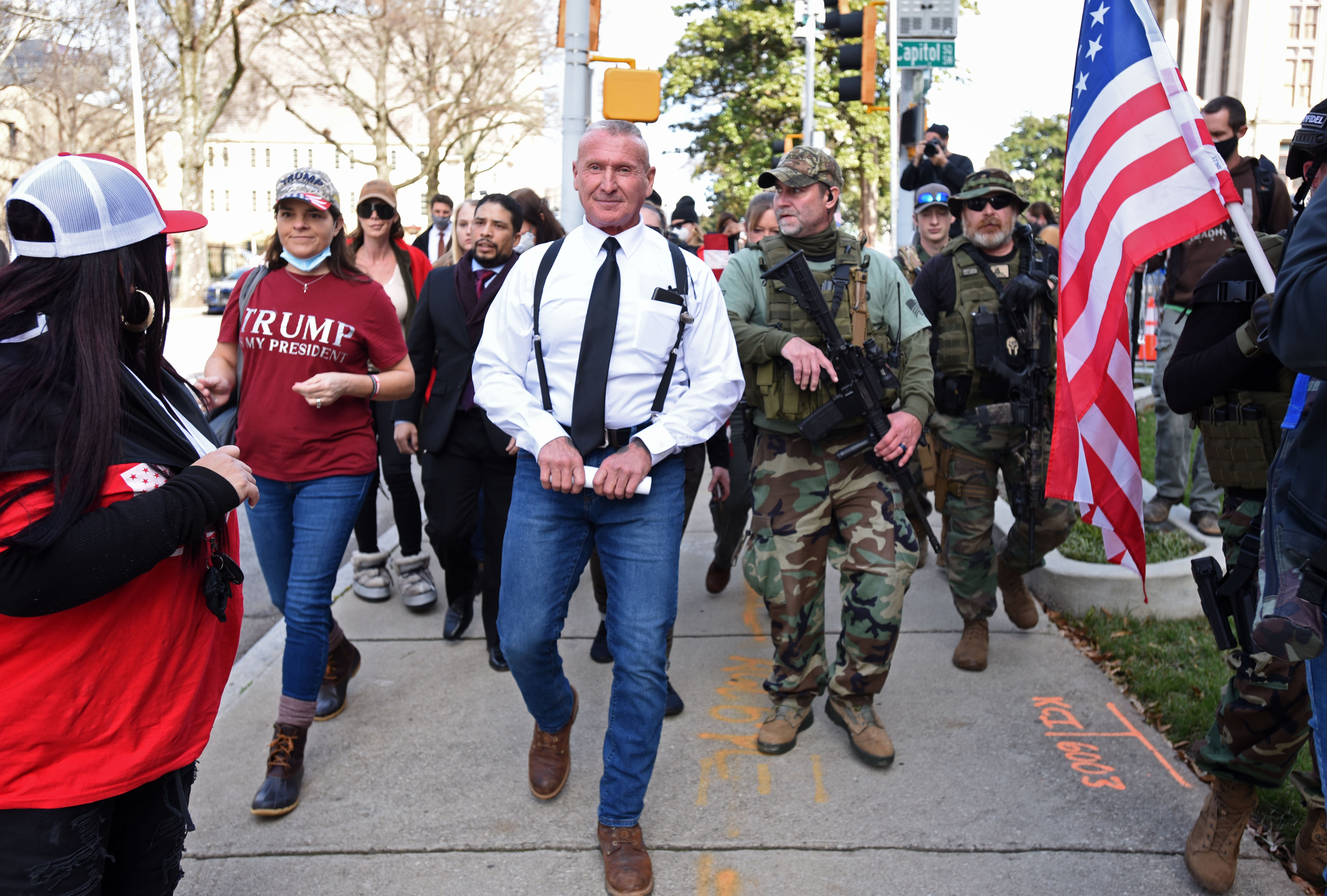 Chester Doles (center), president of American Patriots USA, holding a letter, leads a group of protesters before he delivers the letter inside the Georgia State Capitol during Stop the Still rally organized by American Patriots USA outside the Georgia State Capitol on Wednesday, Jan. 6, 2021. (Hyosub Shin / Hyosub.Shin@ajc.com)