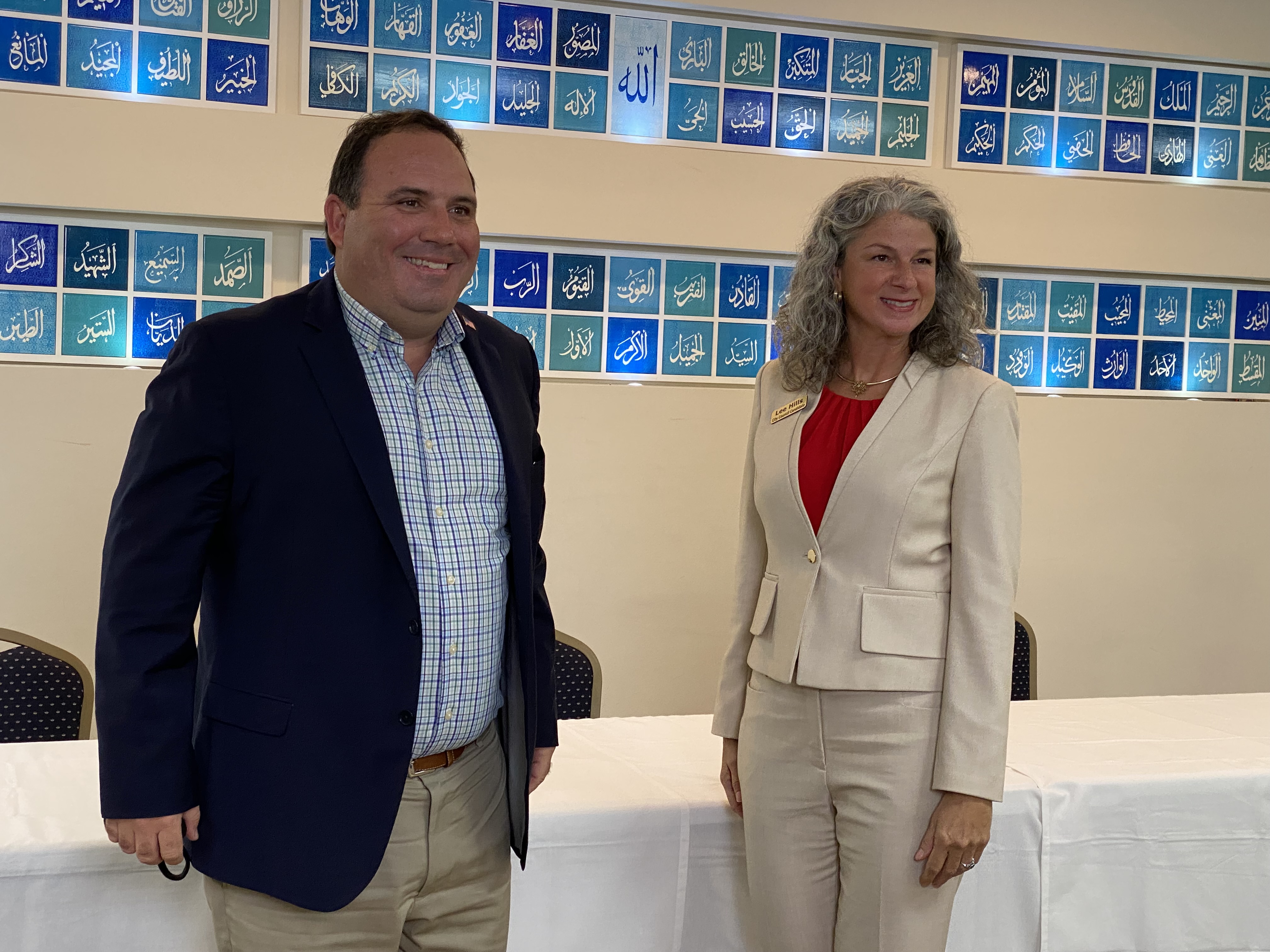 Roswell City Councilman Matt Judy and Lee Hills answered questions in a debate at Roswell Community Masjid.