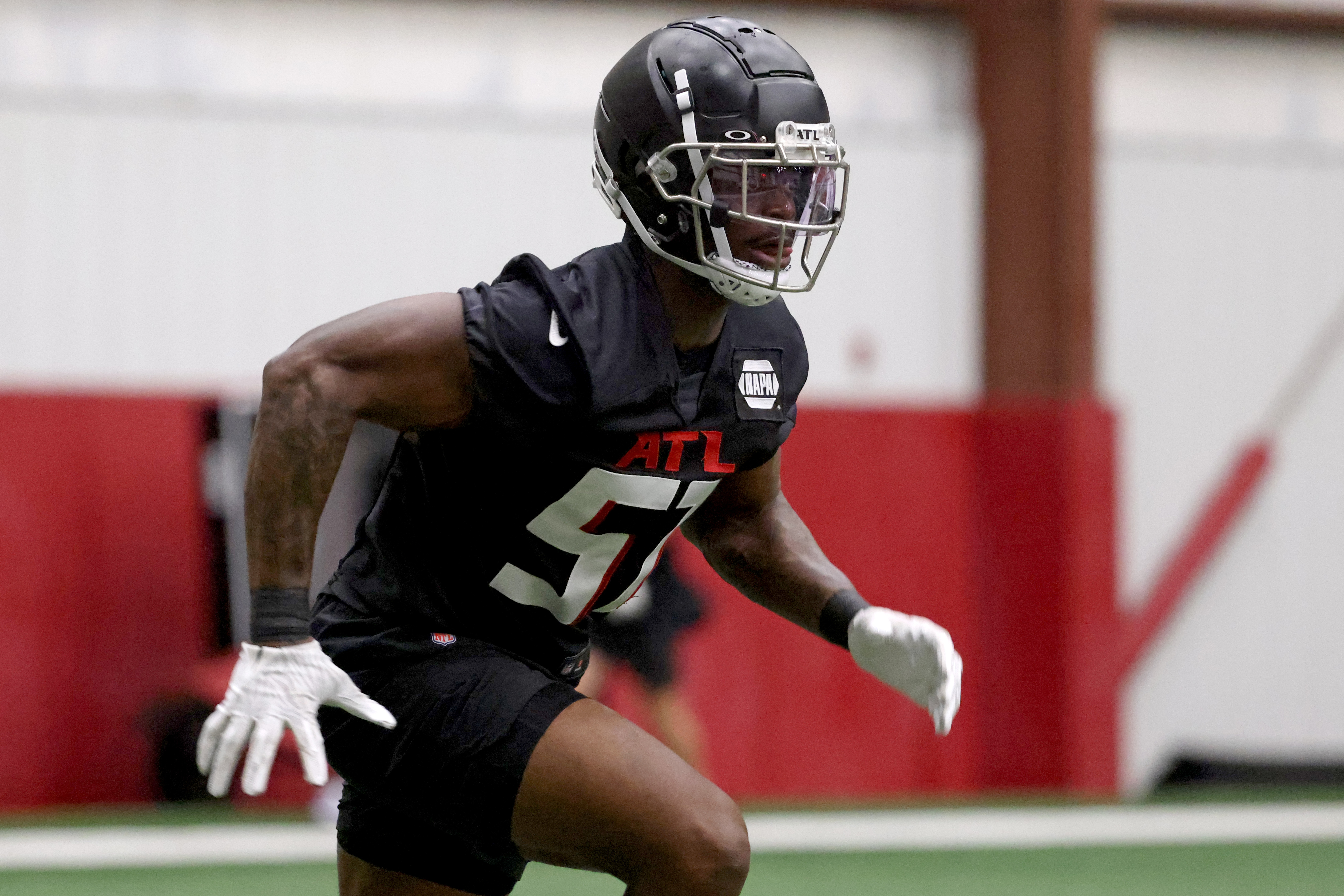 American Team defensive lineman DeAngelo Malone of Western Kentucky (10)  runs through drills during practice for