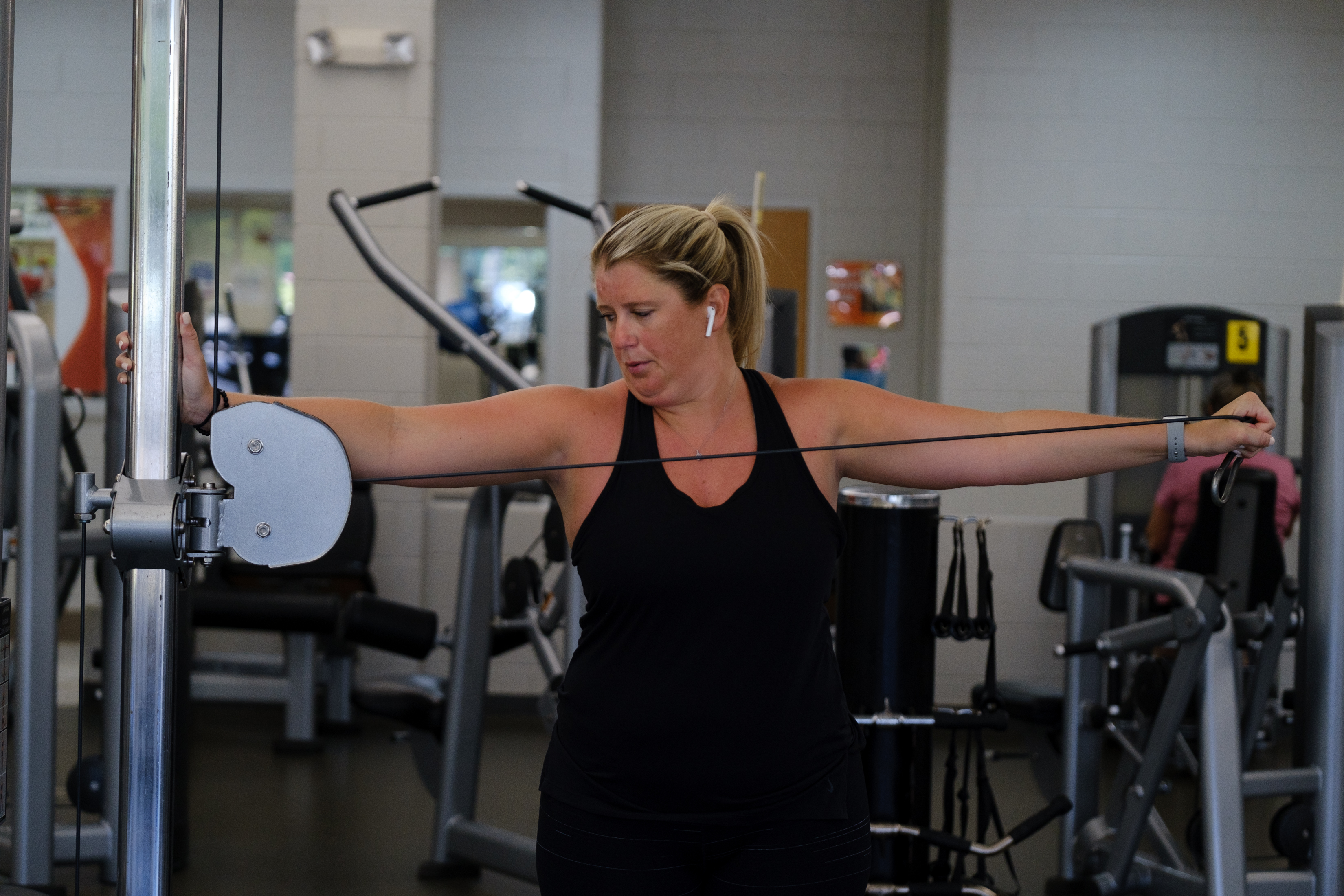 Emily Stevens works out at the YMCA in Gainesville on her day off. Stevens left her previous job as a staff ER nurse in Gainesville, where she worked some of the hardest shifts in the pandemic. She joined an agency as a "traveler," or contract nurse, and is now an ER nurse in Duluth. She is run less ragged by her shifts, and feels that when she has time off she is more able to work on restoring her health. (PHOTO by Arvin Temkar / arvin.temkar@ajc.com)