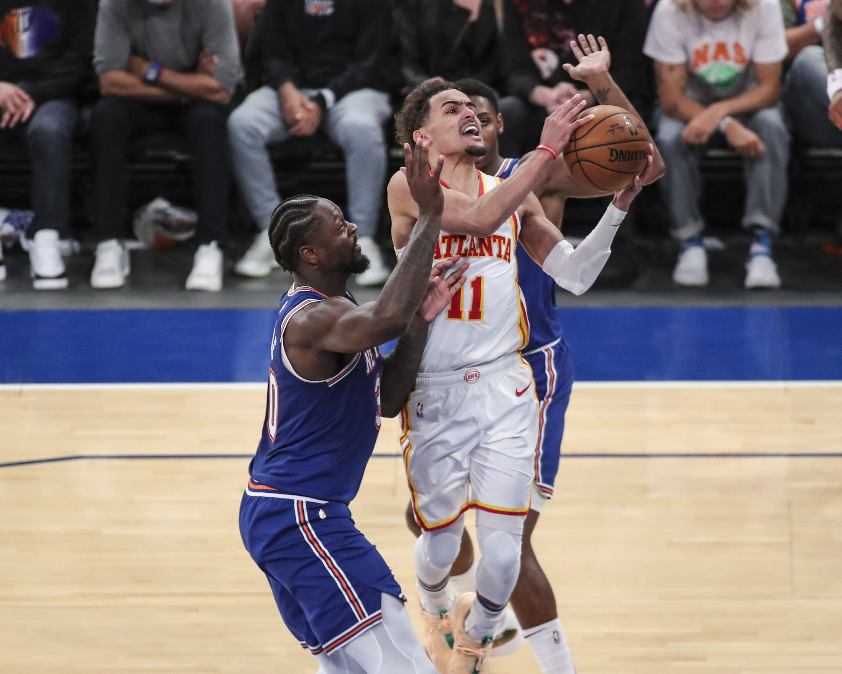 Hawks guard Trae Young (11) drives past New York Knicks forward Julius Randle (30) in the fourth quarter of Game 5 of an NBA basketball first-round playoff series Wednesday, June 2, 2021, in New York. (Wendell Cruz/Pool Photo via AP)