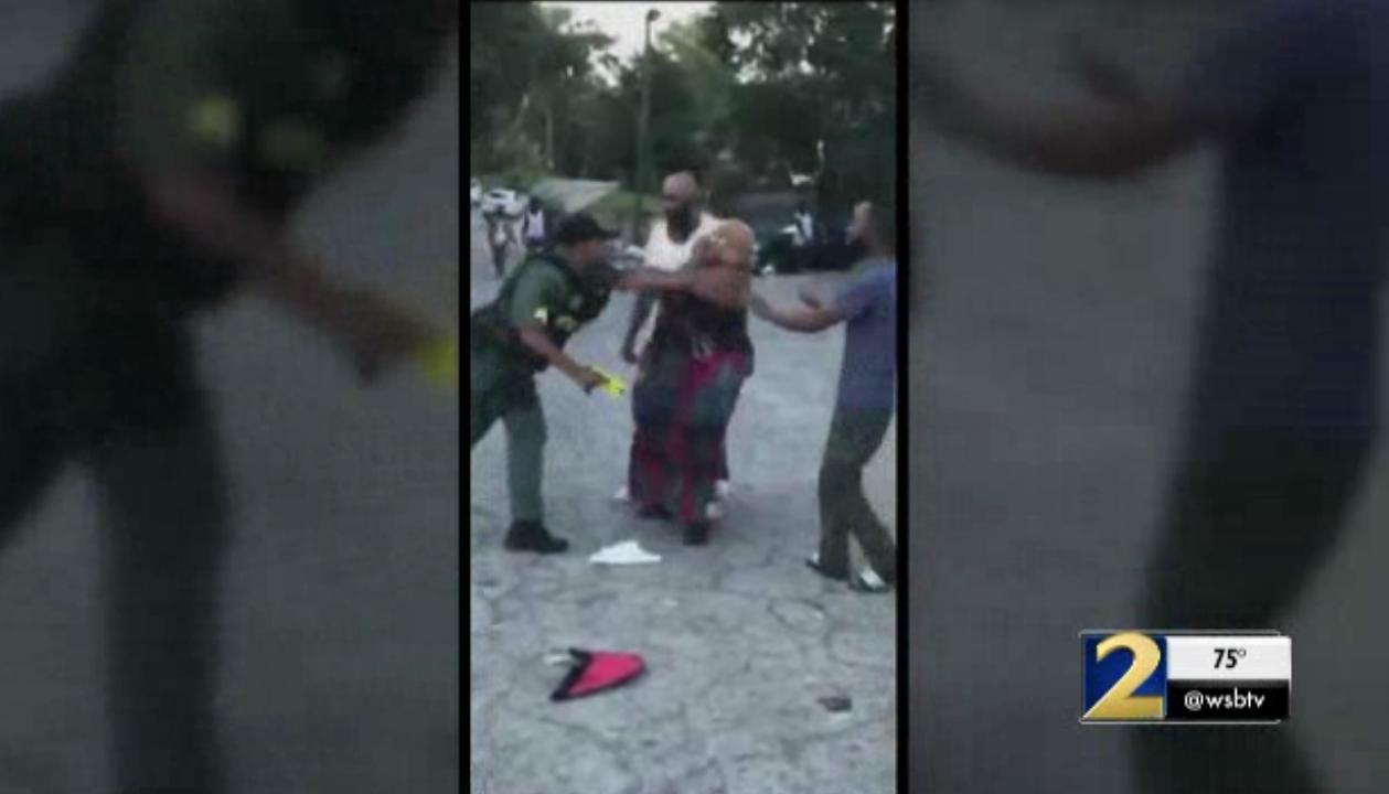 This is a screenshot of the video that appears to show an Atlanta police officer pushing Jennifer Barnwell. (Credit: Channel 2 Action News)