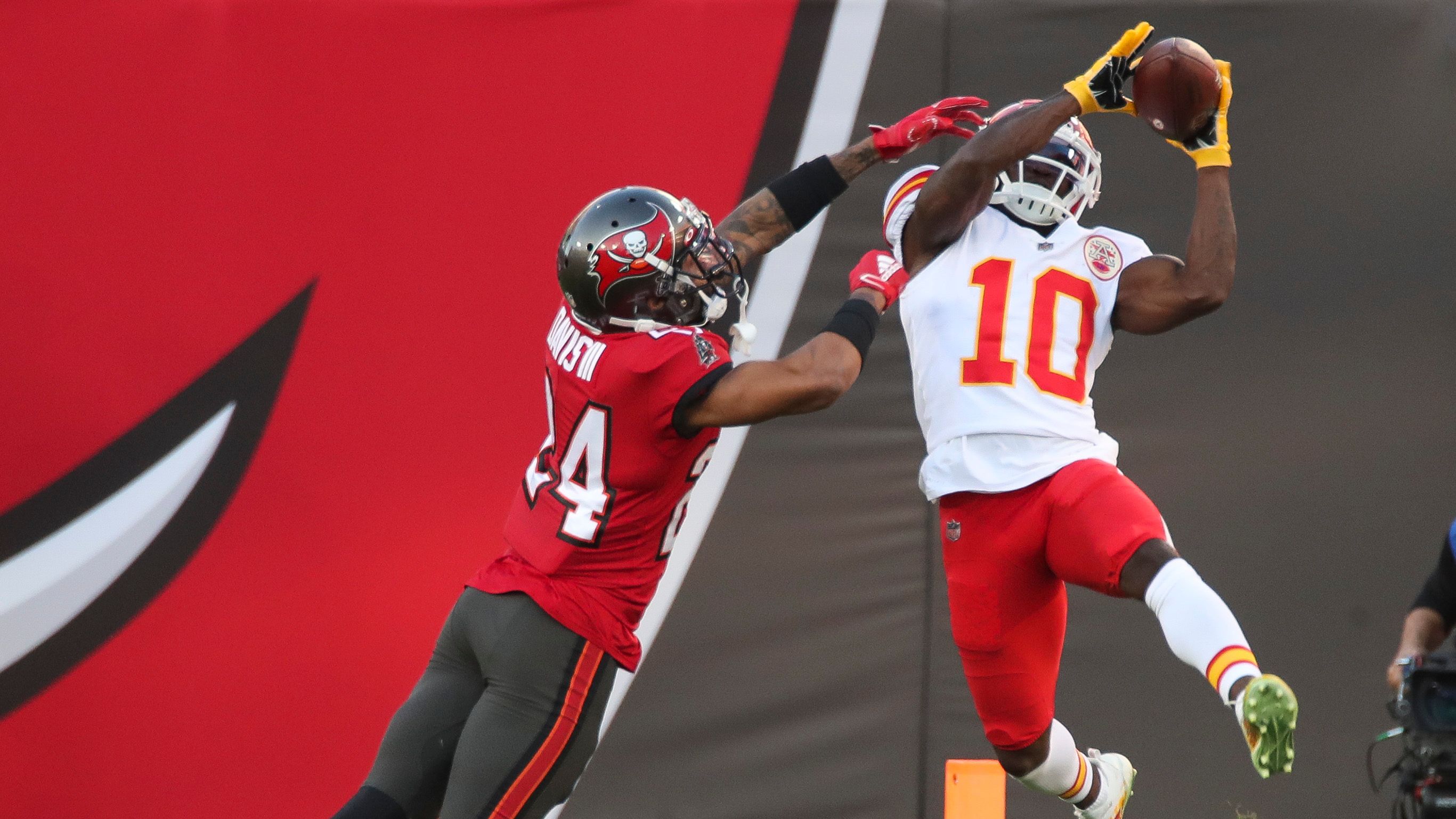 Bucs begin to focus on Chiefs but their hearts are at home