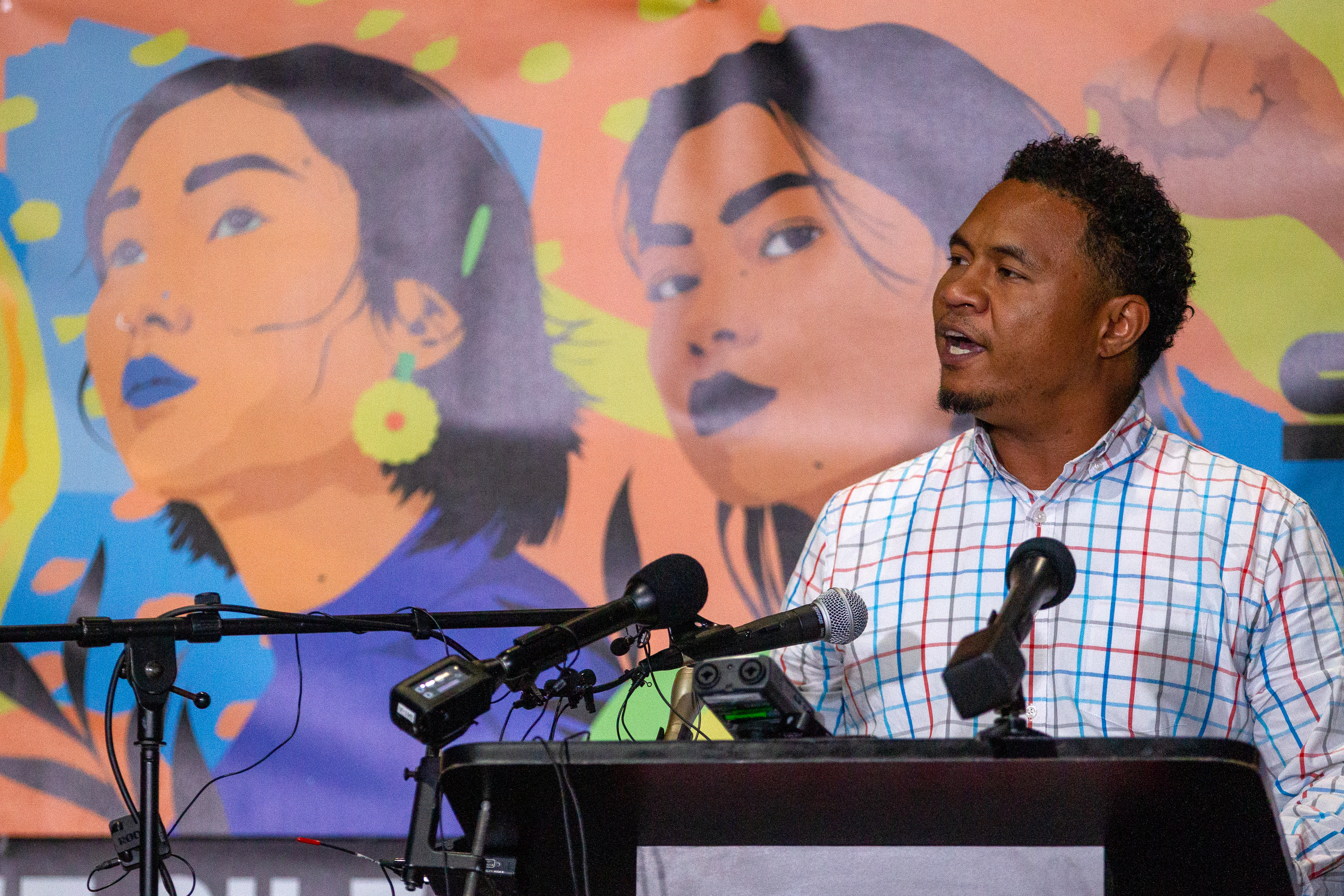 Robert Peterson, the son of March 16 victim Yong Ae Yue talks to the crowd during the Asian Justice 1-year anniversary of the spa shootings rally in Atlanta on March 16, 2022. STEVE SCHAEFER FOR THE ATLANTA JOURNAL-CONSTITUTION