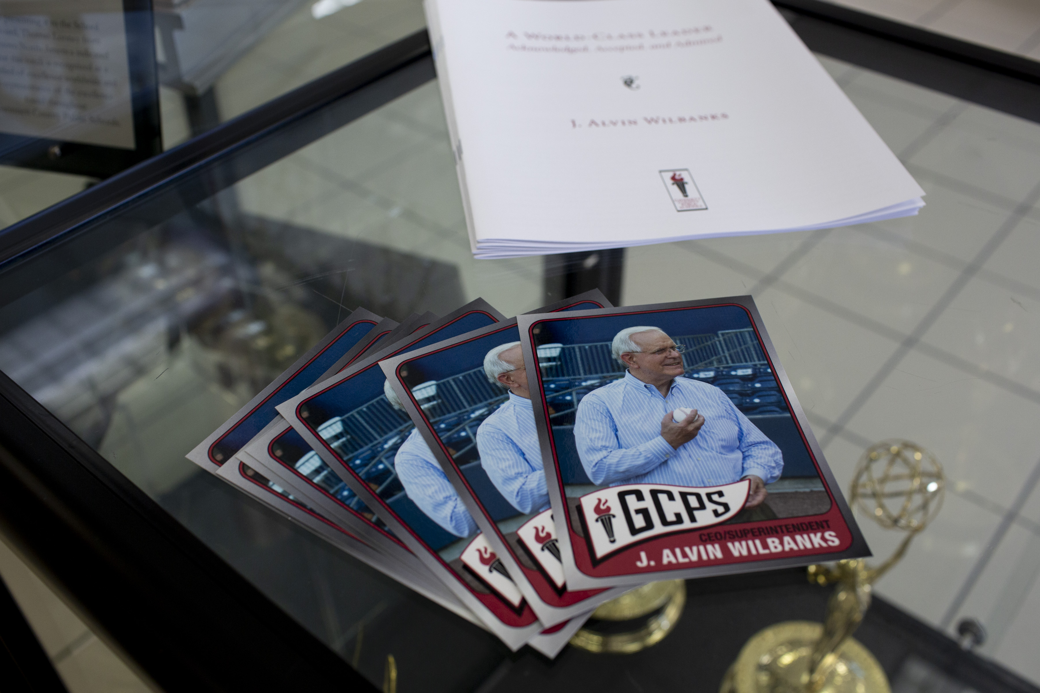 Baseball cards featuring J. Alvin Wilbanks are seen on a table at an informal send-off for Gwinnett County Schools superintendent J. Alvin Wilbanks at the J. Alvin Wilbanks Instructional Support Center in Suwanee, Georgia, on Wednesday, July 28, 2021. (Rebecca Wright for the Atlanta Journal-Constitution)