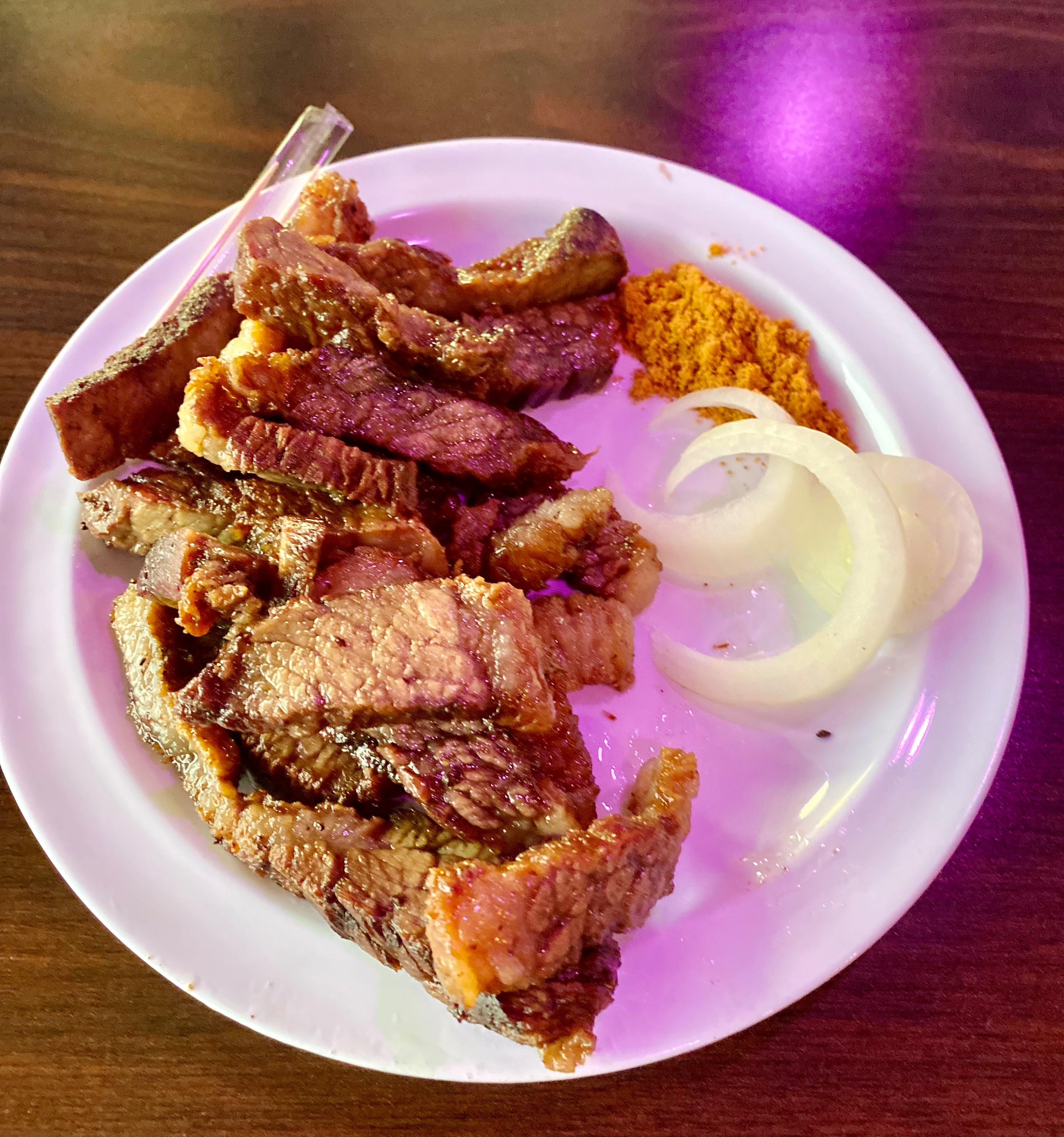 A good way to start your meal at the Island Grill is with a plate of suya, a grilled beef snack that is typical of street food in Nigeria. It goes well with beer. Wendell Brock for The Atlanta Journal-Constitution