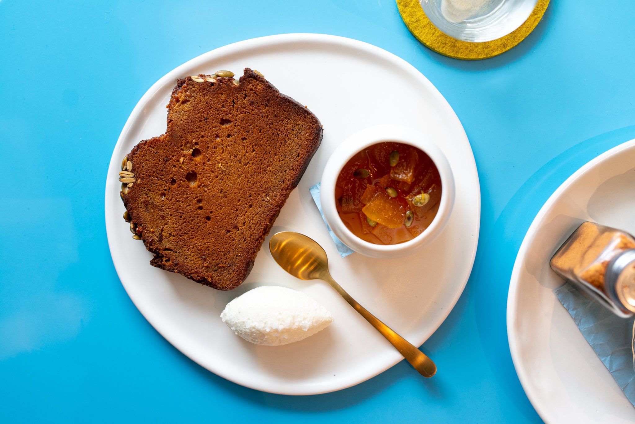 Warm Pumpkin Bread with whipped Decimal Place feta, and pumpkin seed agrodolce. Mia Yakel for The Atlanta Journal-Constitution