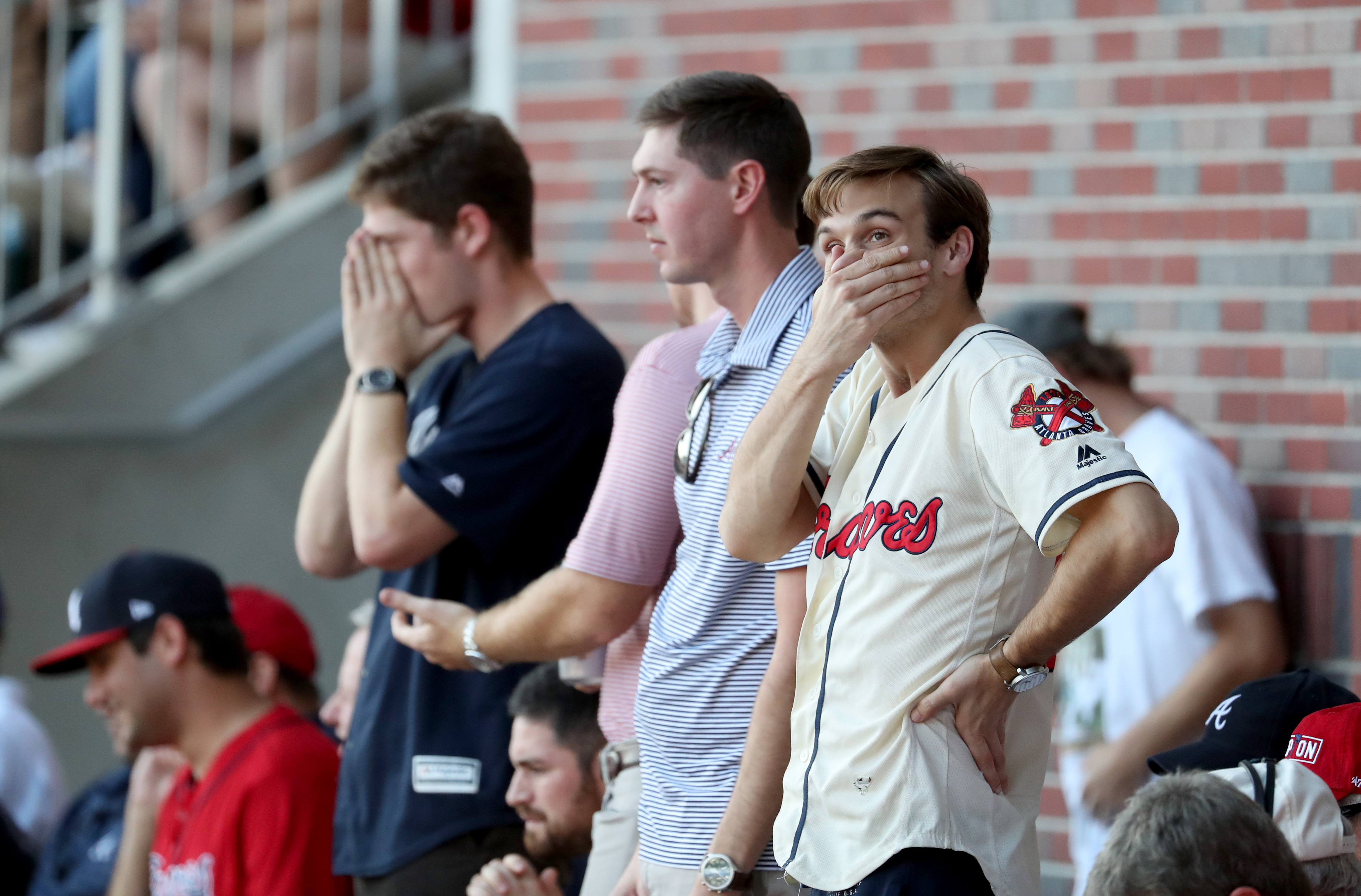 Braves fans at SunTrust Park feel the pain of season-ending loss