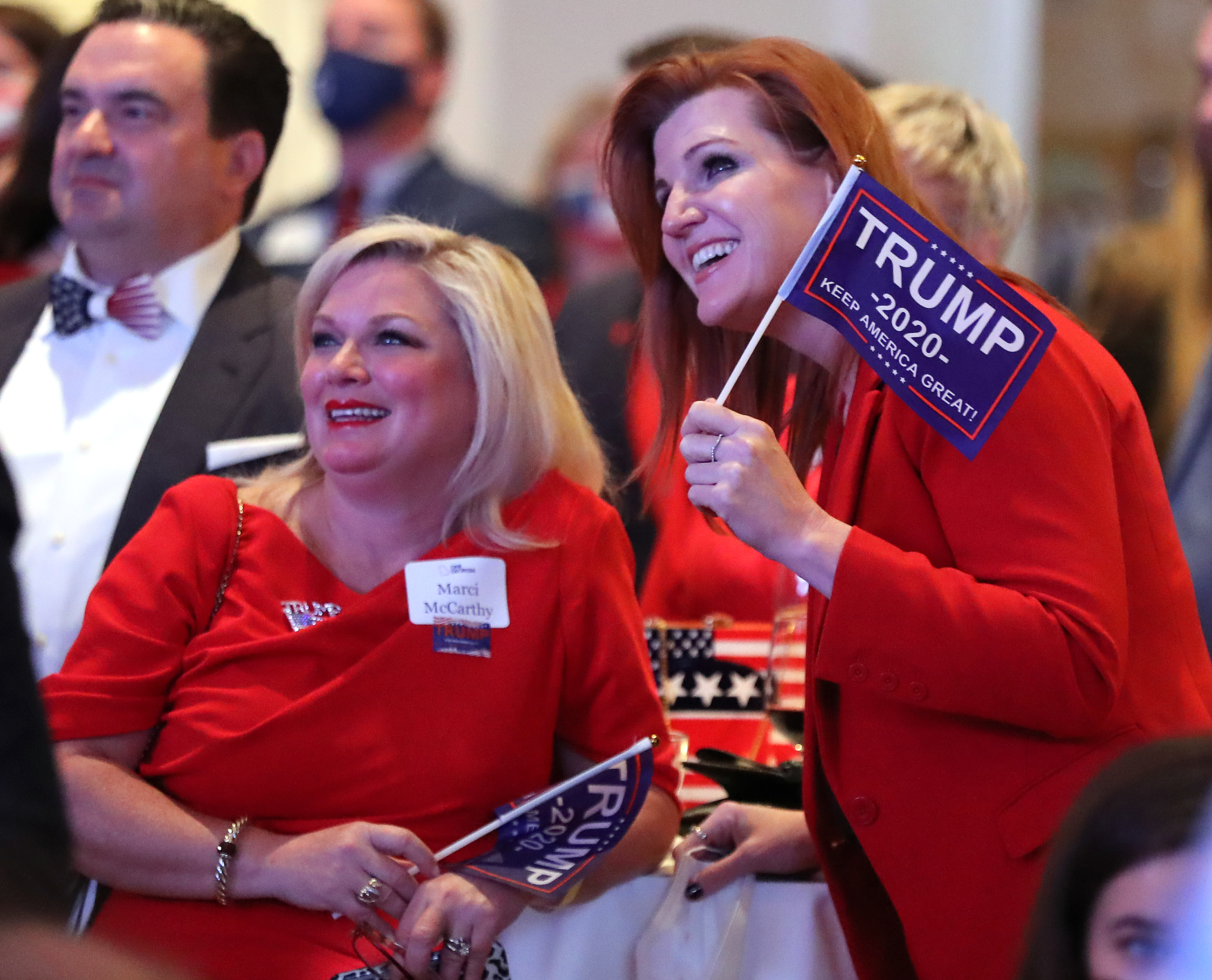 110320 Atlanta: Kirsten Davies, right, and Marci McCarthy react while watching returns for Georgia coming in at the Georgia Republican Party Election Night Celebration in the Intercontinental Buckhead Atlanta hotel on Tuesday, Nov 3, 2020 in Atlanta. “Curtis Compton / Curtis.Compton@ajc.com”