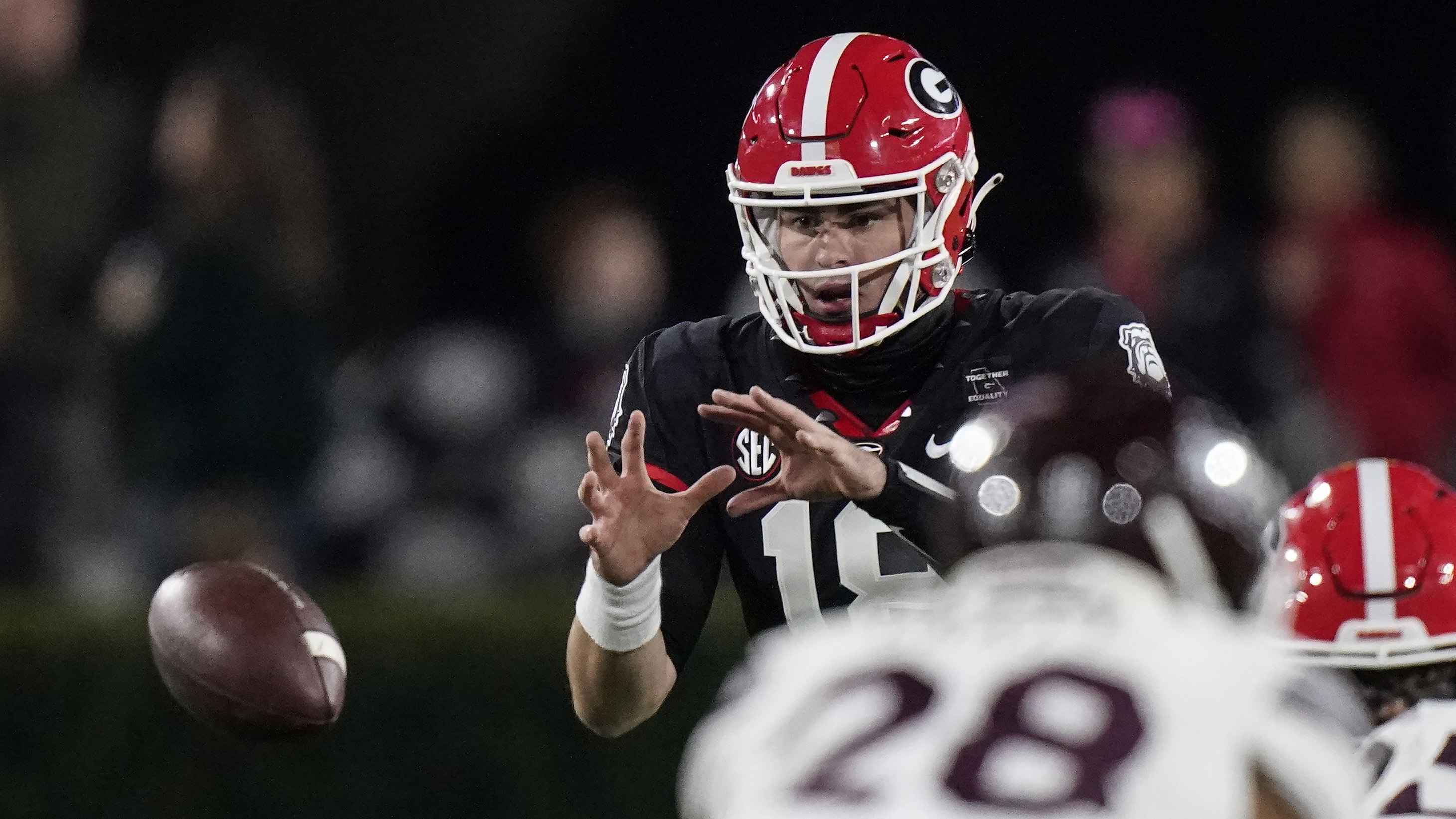 Georgia quarterback JT Daniels (18) takes a snap Saturday, Nov. 21, 2020, in Athens. (Brynn Anderson/AP)