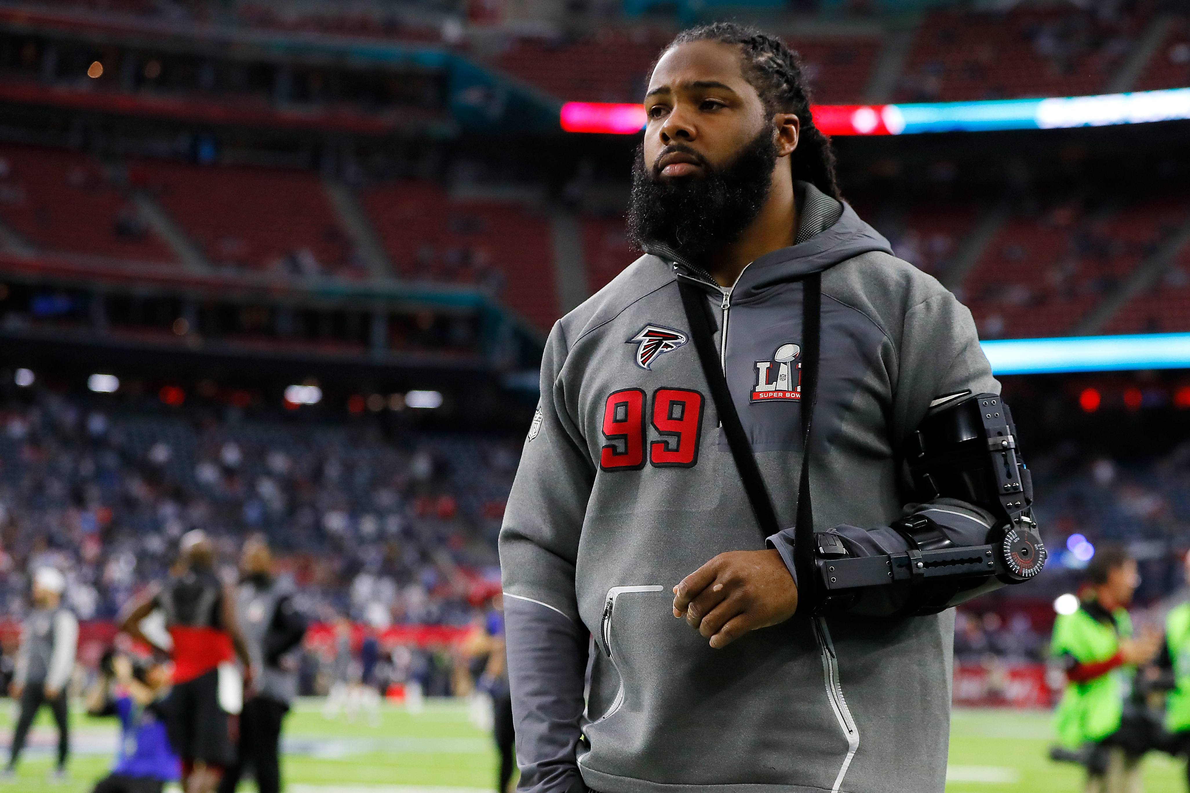 Kirk Ferentz celebrates with former Iowa football player Adrian Clayborn  after Patriots win Super Bowl