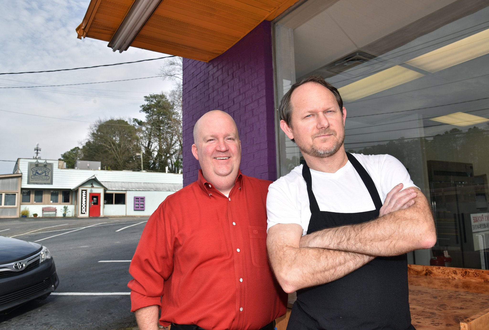 Portrait of Jason Sheetz (left) and William Sigley with Hammocks restaurant, which is owned by the duo, in background, in Sandy Springs on February 14, 2019. HYOSUB SHIN / HSHIN@AJC.COM