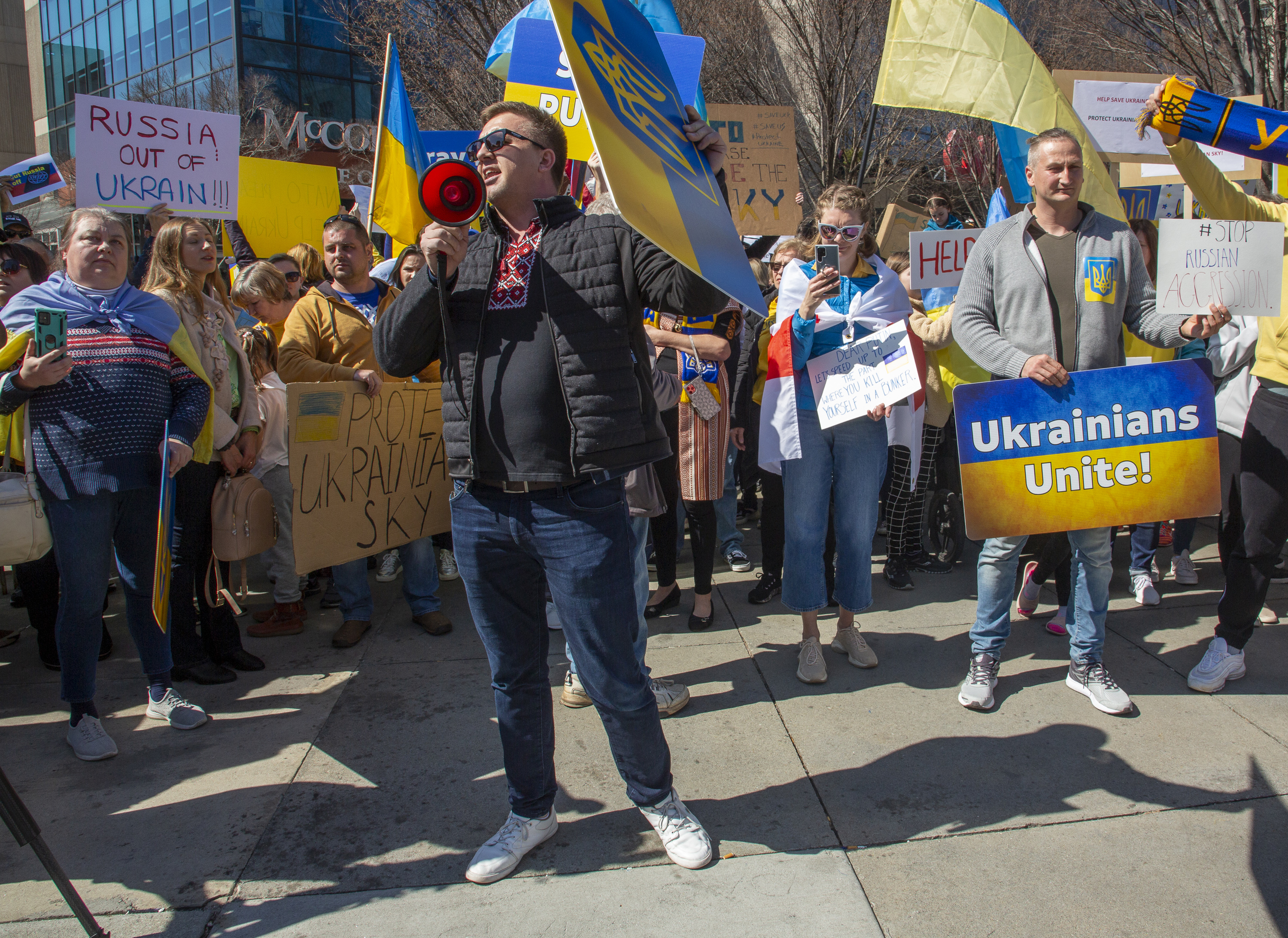 People show their support for Ukraine during a rally near the CNN Center on Saturday, February 26, 2022. STEVE SCHAEFER FOR THE ATLANTA JOURNAL-CONSTITUTION