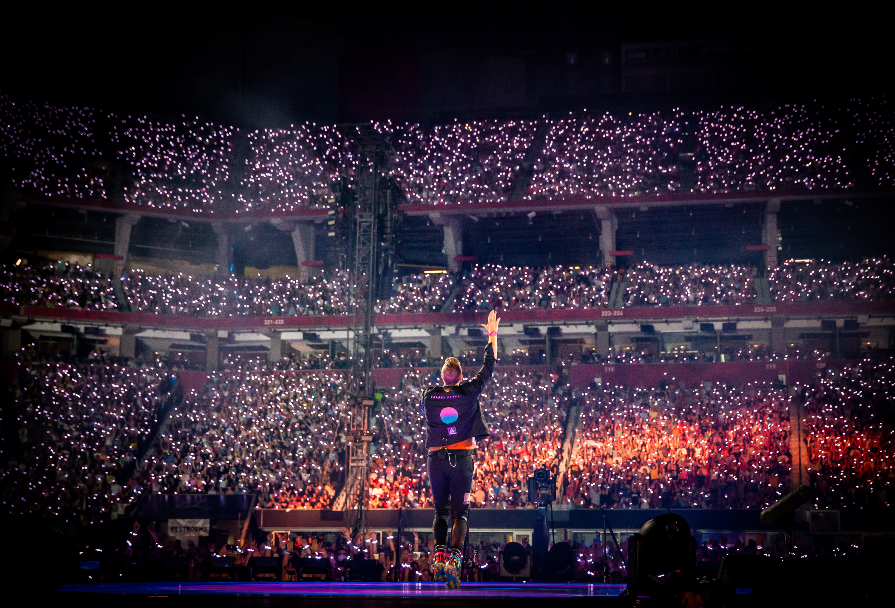 Will Champion of Coldplay performs on stage at Wembley Stadium