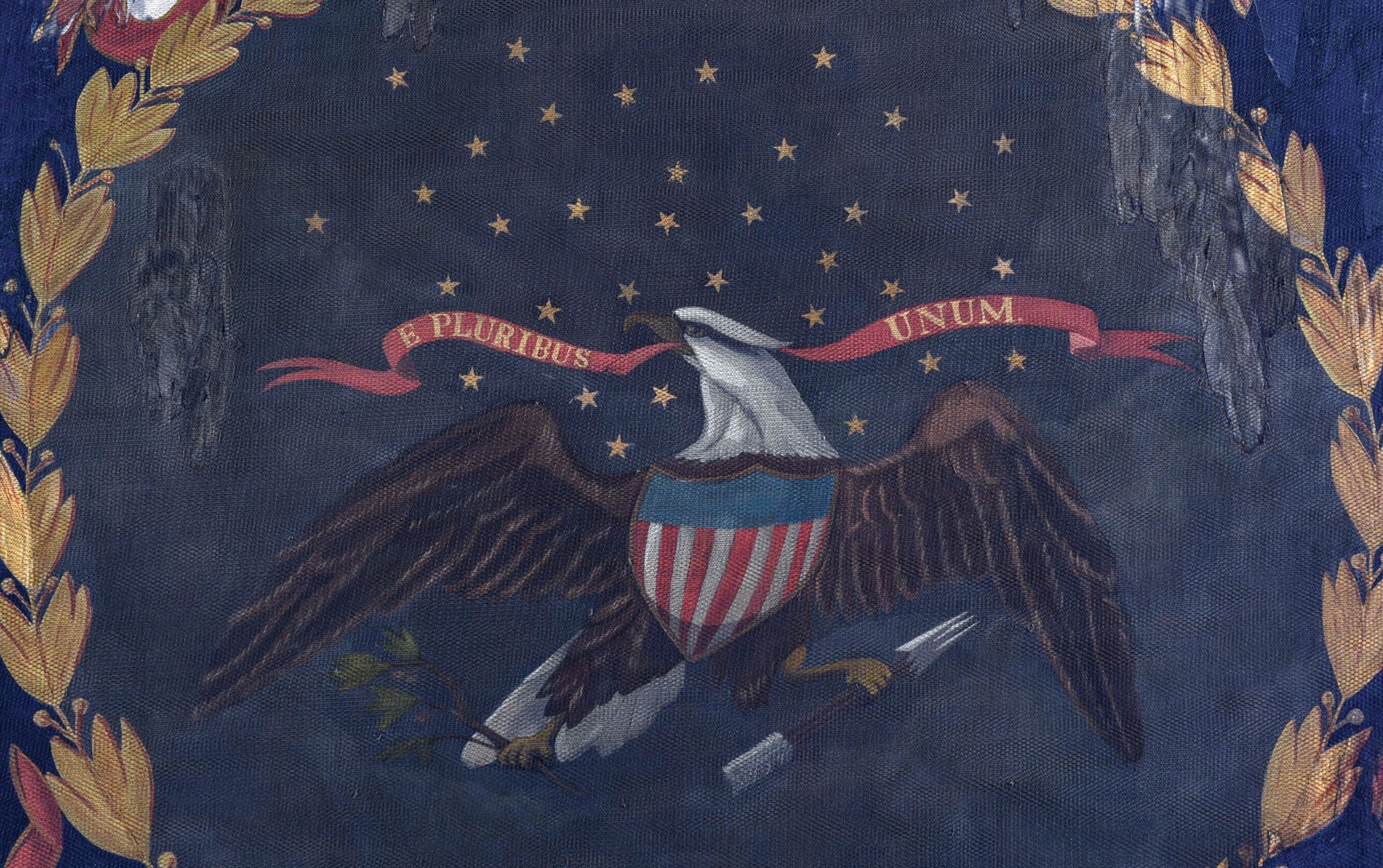 A detail of the battle flag from the 127th Regiment of the U.S. Colored Troops shows some of the repair work done by conservators, along with the motto "E Pluribus Unum." CONTRIBUTED: MORPHY AUCTIONS