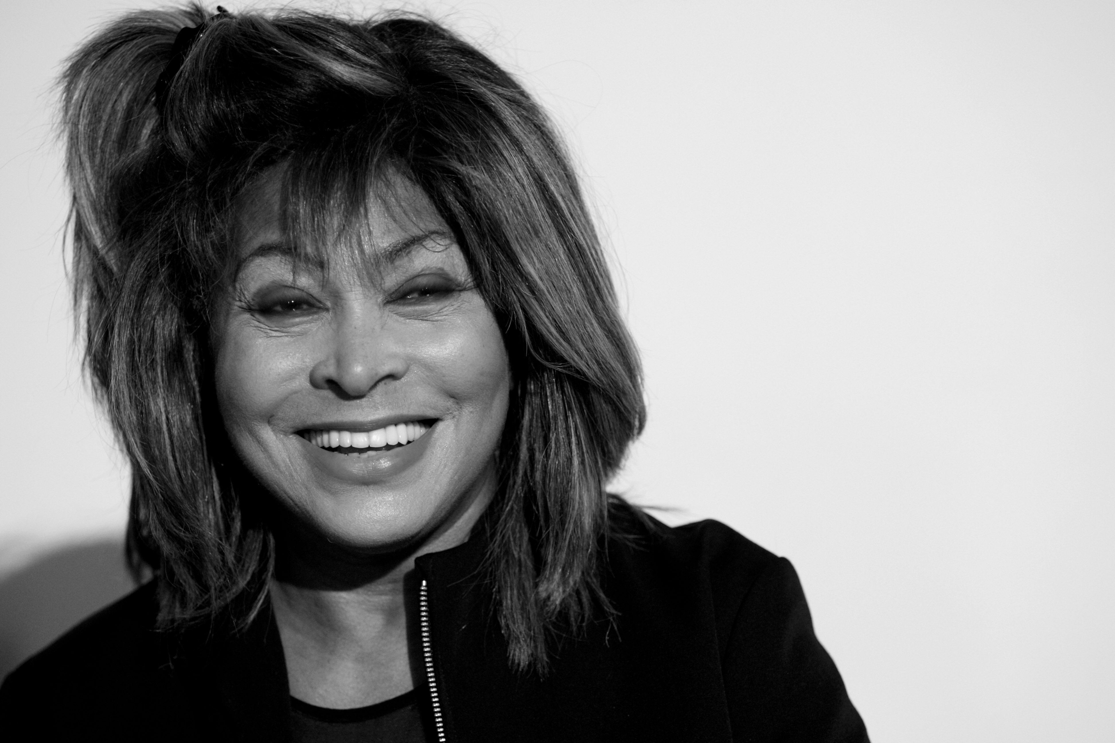 ZURICH, SWITZERLAND - MAY 14: (EDITORS NOTE: This image was converted into black and white.) Tina Turner smiles during the presentation of the music project 'Beyond - Three Voices For Peace' on May 14, 2009 in Zurich, Switzerland. The CD contains a spiritual message by Tina Turner. (Photo by Miguel Villagran/Getty Images)