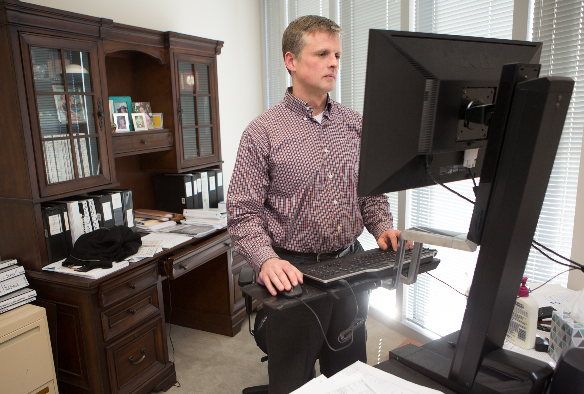 Aaron Dixon works at his desk at the Alston & Bird offices in Atlanta on January 24th, 2018. For story in the AJC Top Workplaces section. (Photo by Phil Skinner)