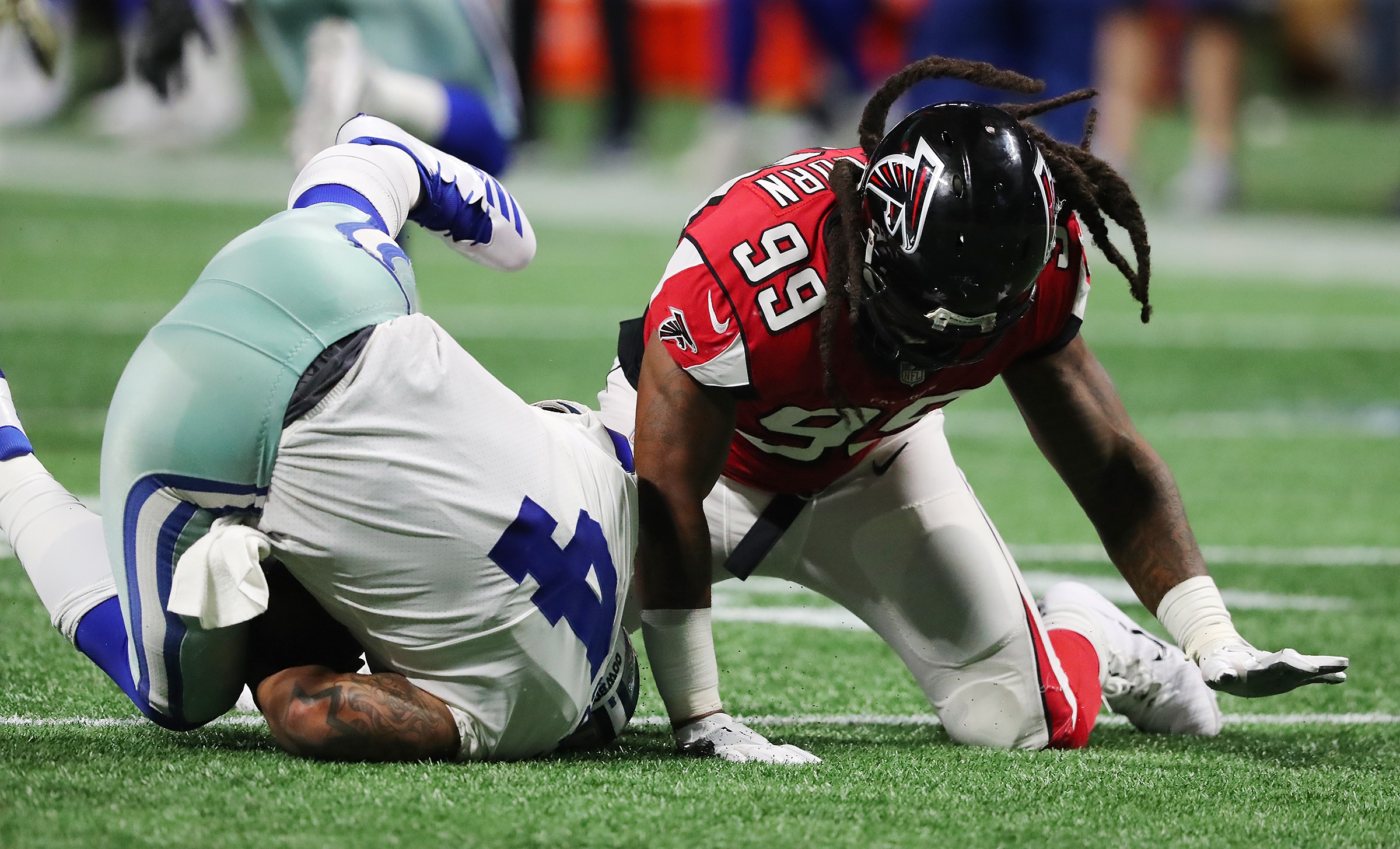 Atlanta Falcons running back Warrick Dunn (28) gets past Cleveland