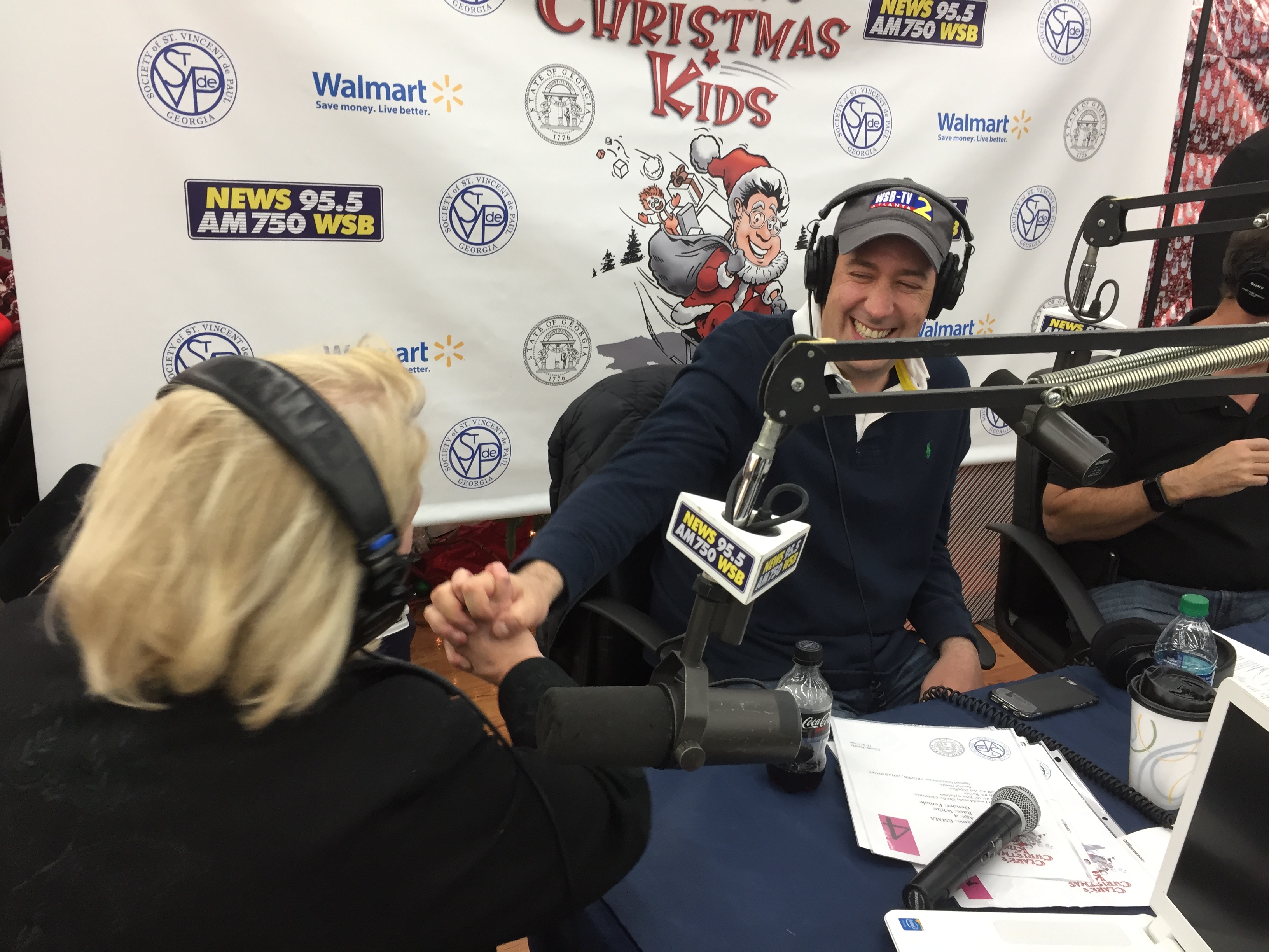 Mark Arum jokes with Karen Emory on air. CREDIT: Rodney Ho/ rho@ajc.com