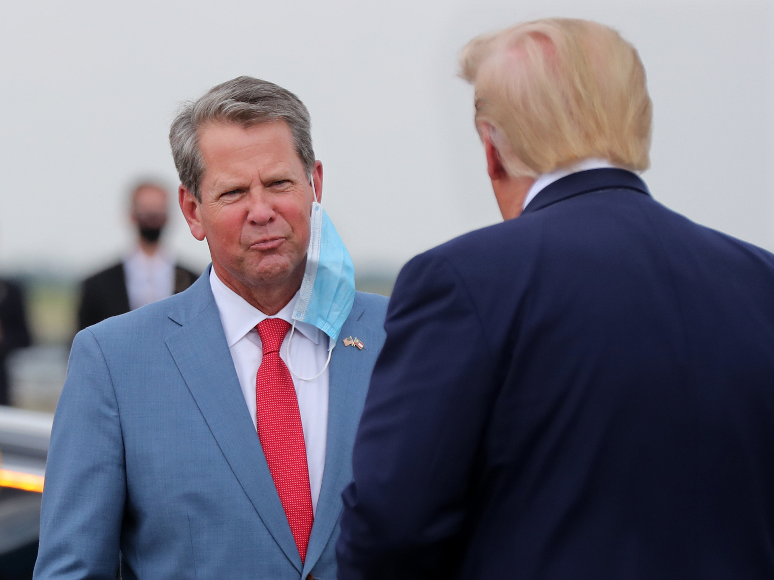 071520 Atlanta: Georgia Governor Brian Kemp greets President Donald Trump as he visits Georgia to talk about an infrastructure overhaul at the UPS Hapeville hub at Hartsfield-Jackson International Airport on Wednesday July 15, 2020 in Atlanta. The visit focuses on a rule change designed to make it easier to process environmental reviews. Curtis Compton ccompton@ajc.com
