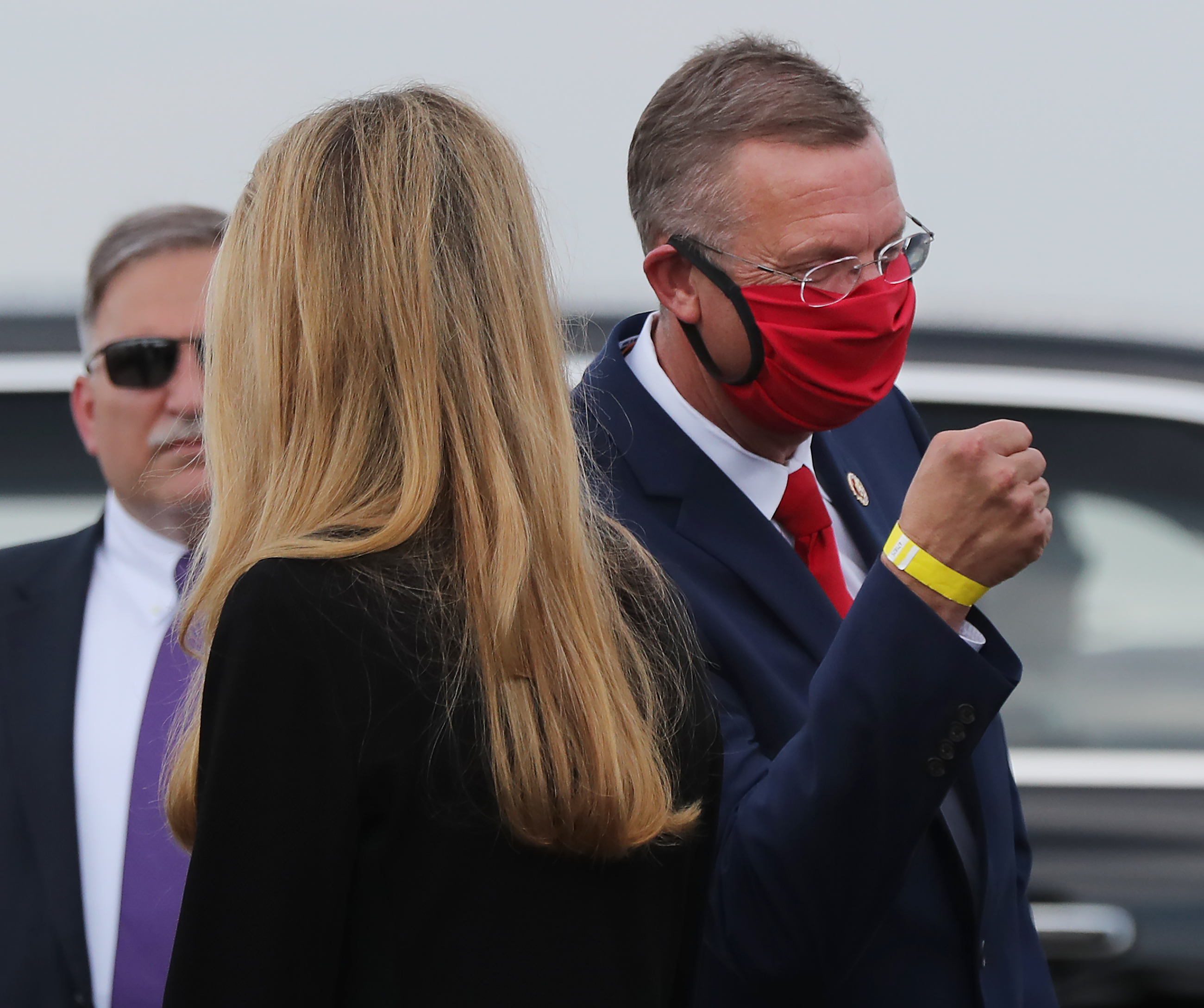 U.S. Sen. Kelly Loeffler passes by her top Republican rival in November's special election, U.S. Rep. Doug Collins, upon the arrival of President Donald Trump in July at at Hartsfield-Jackson International Airport. Curtis Compton ccompton@ajc.com