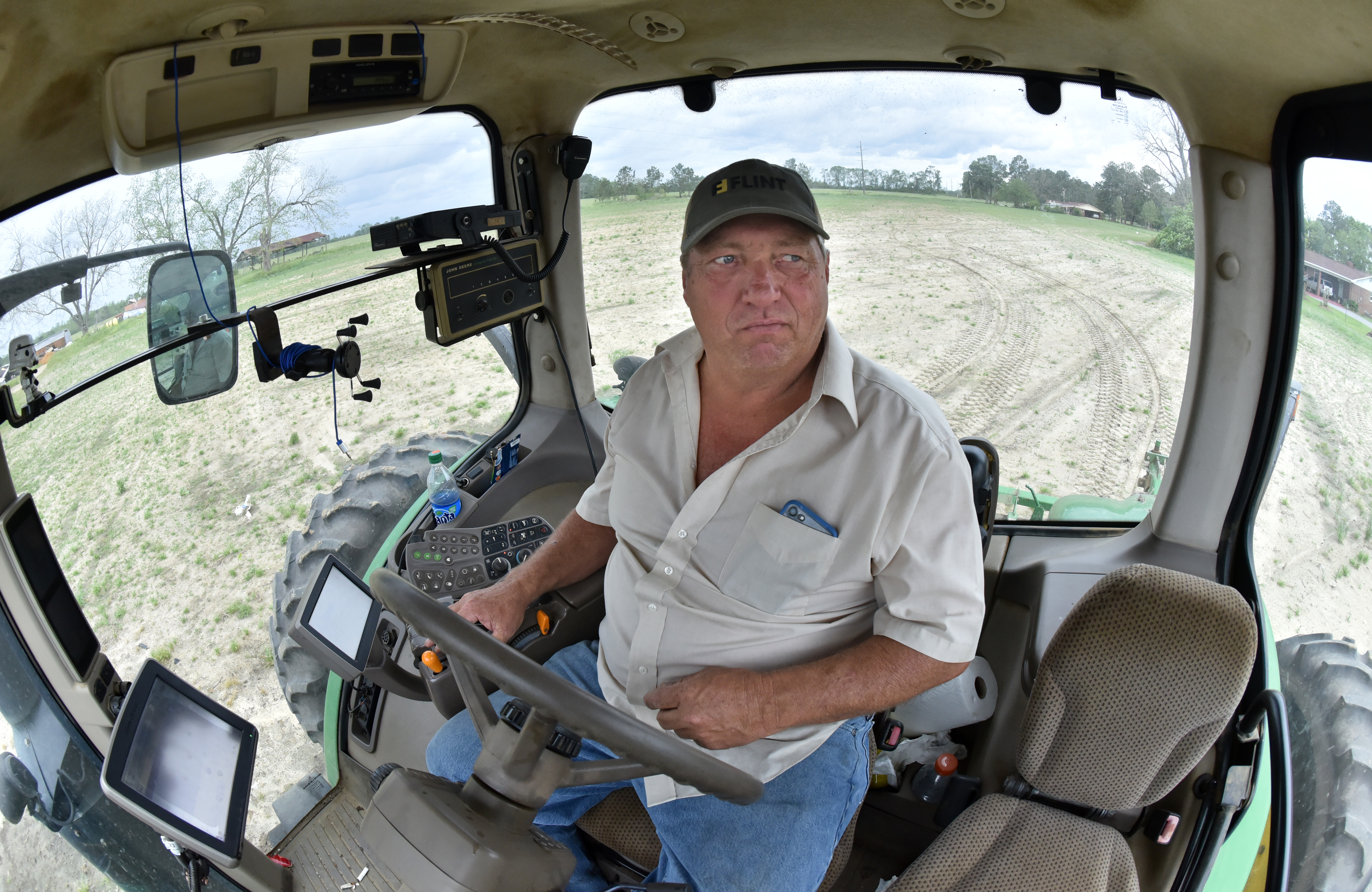 April 8, 2019 Meigs - Ken Hickey operates a John Deere utility tractor as he prepares his cotton field at Hickey Farms in Meigs on Monday, April 8, 2019. Congress' delay in finalizing an aid package for Hurricane Michael victims has had a real impact on the ground in Georgia. HYOSUB SHIN / HSHIN@AJC.COM