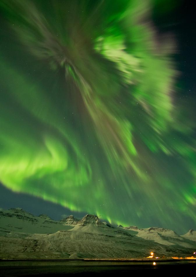 An aurora on March 8, 2012 shimmering over snow-covered mountains in Faskrudsfjordur, Iceland.