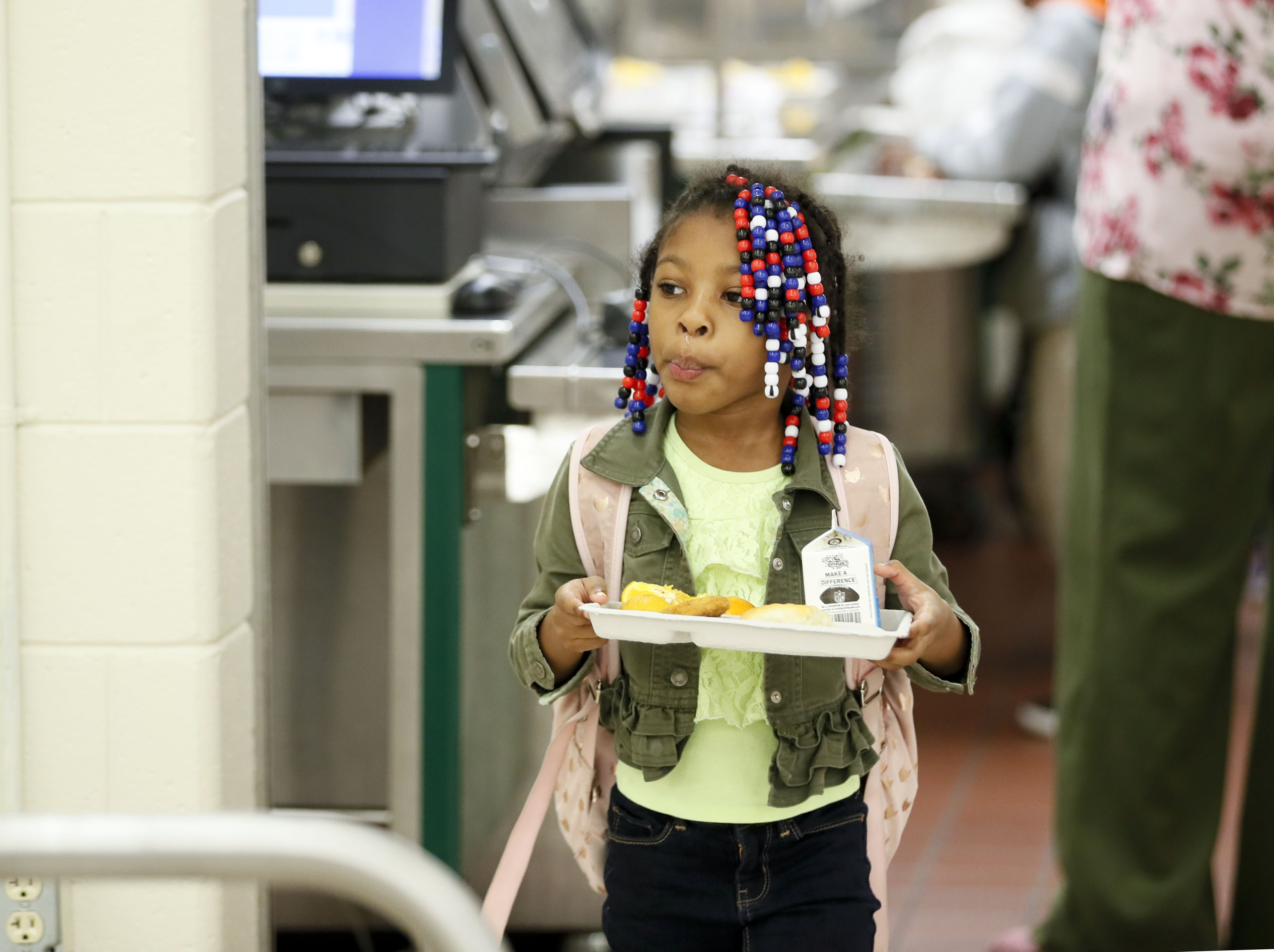 Providing basic essentials, such as hot meals for students, is also part of Harper-Archer’s mission. Bob Andres / robert.andres@ajc.com