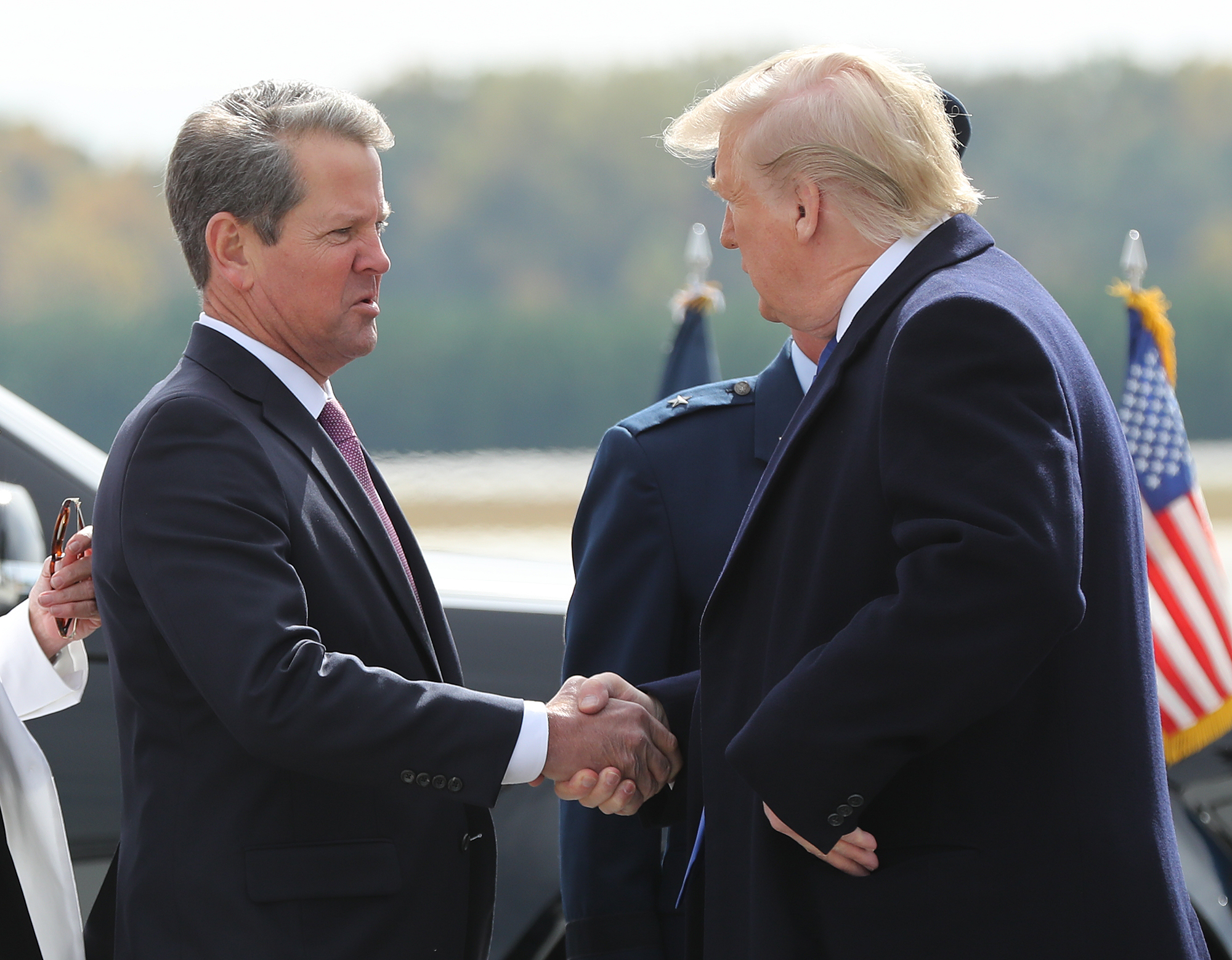 November 8, 2019 Marietta: Georgia Governor Brian Kemp greets President Donald Trump as he arrives at Dobbins AFB on Friday, November 8, 2019, in Marietta. Curtis Compton/ccompton@ajc.com